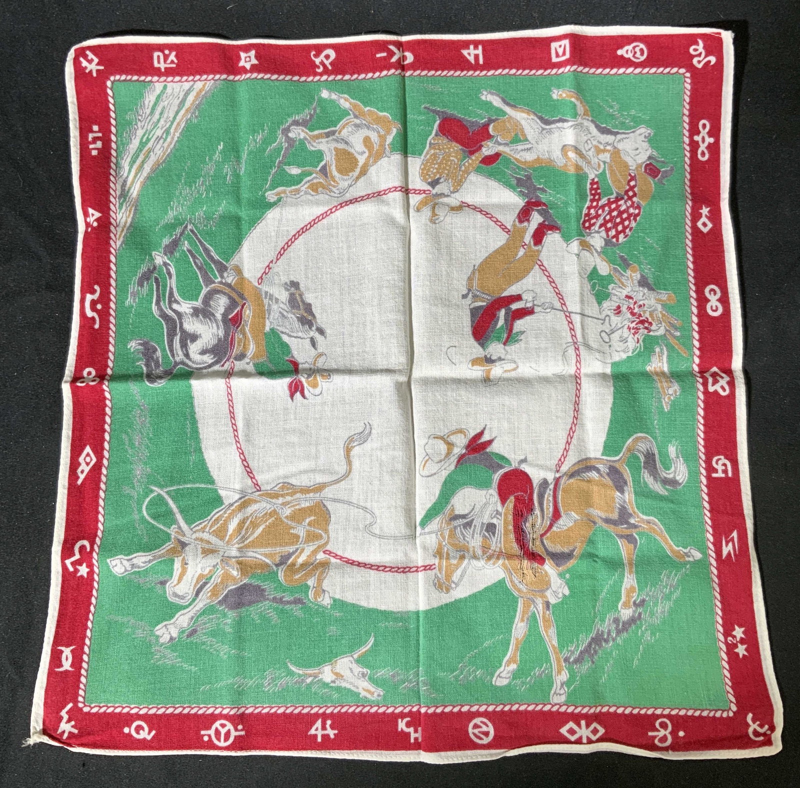 Vintage Cotton Cowboy Hankie: Vintage handkerchief with cowboy, horse, and bull motif. Some fading and tearing to fabric. Measures approx. 12 x 13 inches. Material feels like cotton. Hankie, handkerchief, vintage Hankie, vintage h