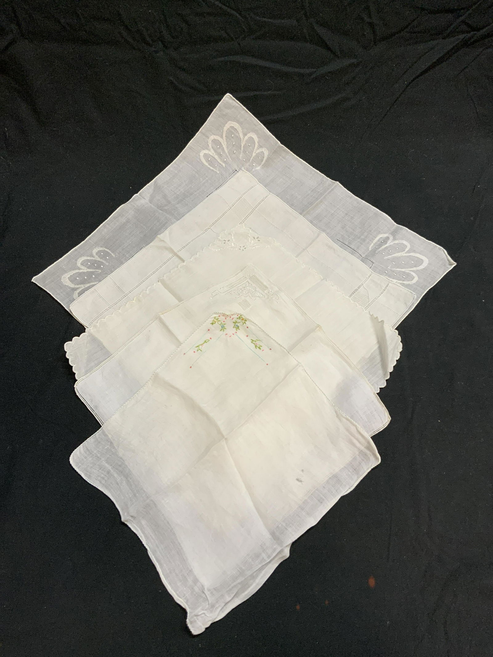 Group 5 Vintage White Cotton Handkerchiefs: Group of 5 vintage white handkerchiefs. All pieces have decorative embroidery. All pieces have some wear to fabric consistent with exposure. Sizes vary, largest approx. 14 x 13.5 inches, smallest appr