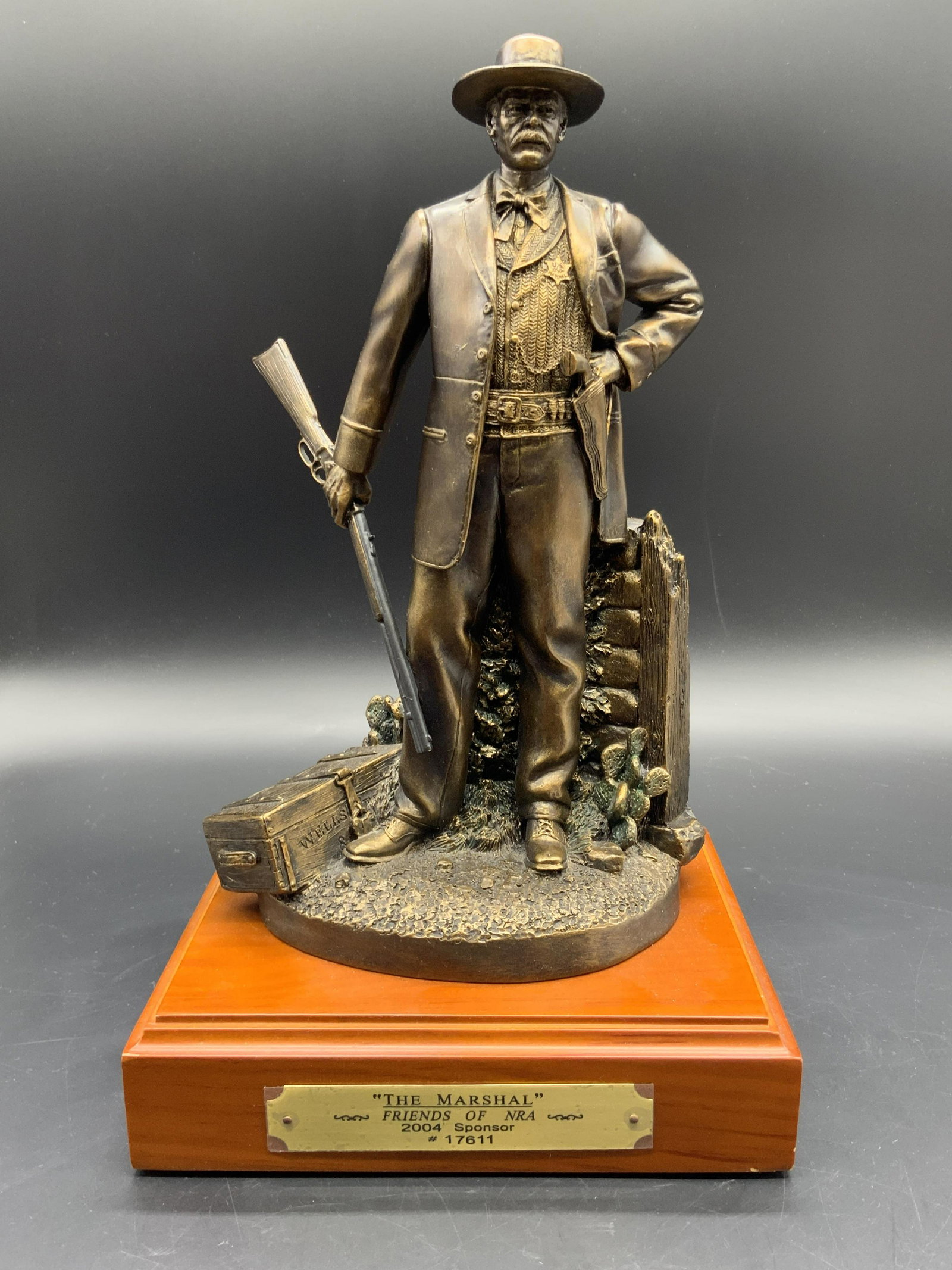 R. Terry 2004 Friends of NRA THE MARSHAL Sculpture: Sculpture depicts a man with a firearm in one hand and his other hand on his hip. 2004 Friends of NRA THE MARSHAL Sculpture #17611, with a brass name plate on the front. Made out of pewter components 