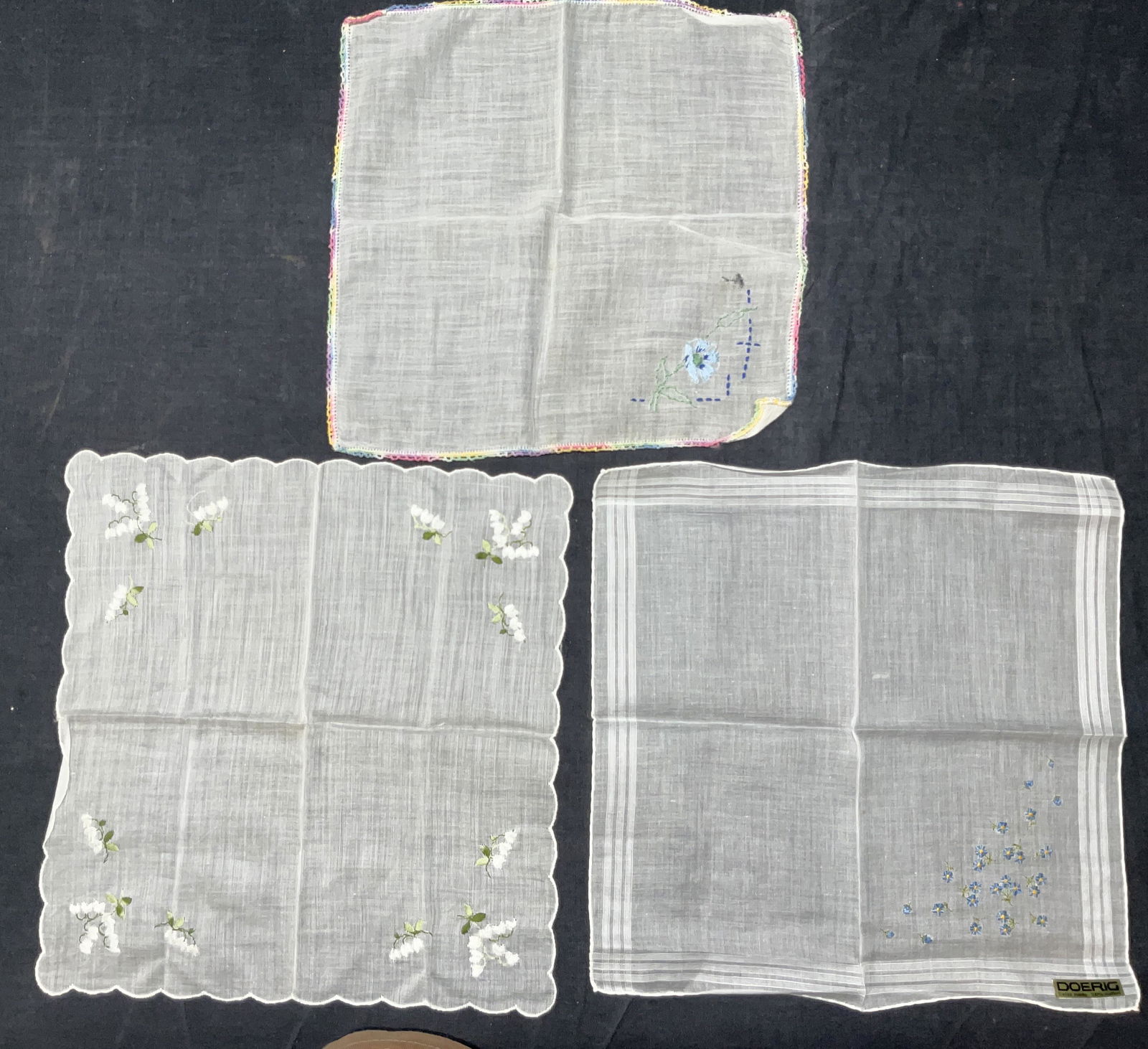 Lot 3 Floral Embroidered Doilies: Lot 3 Floral Embroidered Doilies. Measures approx 10.5 x 10 inches. One doily labeled with Doerig Swiss made 100% cotton. Minimal wear to pieces. One has minor tear to piece. Doilies, embroidered doil