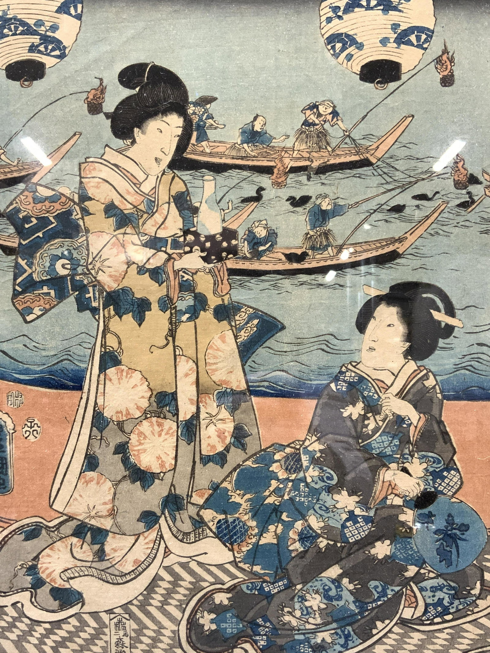 Toyokuni Style Ukiyo-e Japanese WoodBlock Art: Written in left corner in graphite, Toyokuni. Subject depicts 2 Japanese women in traditional kimonos, 1 presenting sake to the other with fishermen in boats in the background. Marked on left corner w