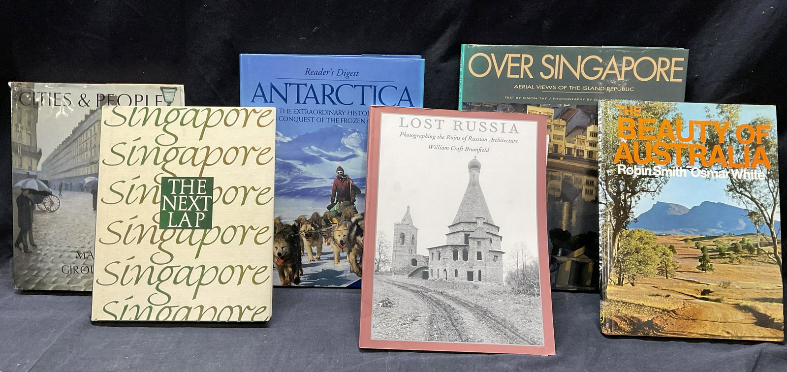 Lot 6, Travel Books, Australia, Antarctica & More: Lot 6 Coffee Table Books, Travel Books & More. Titles include, ‘Cities & People CR 1985, The Beauty of Australia, The Next Lap Singapore CR 1991, Lost Russia CR 1995, Over Singapore CR 1993, Antarct