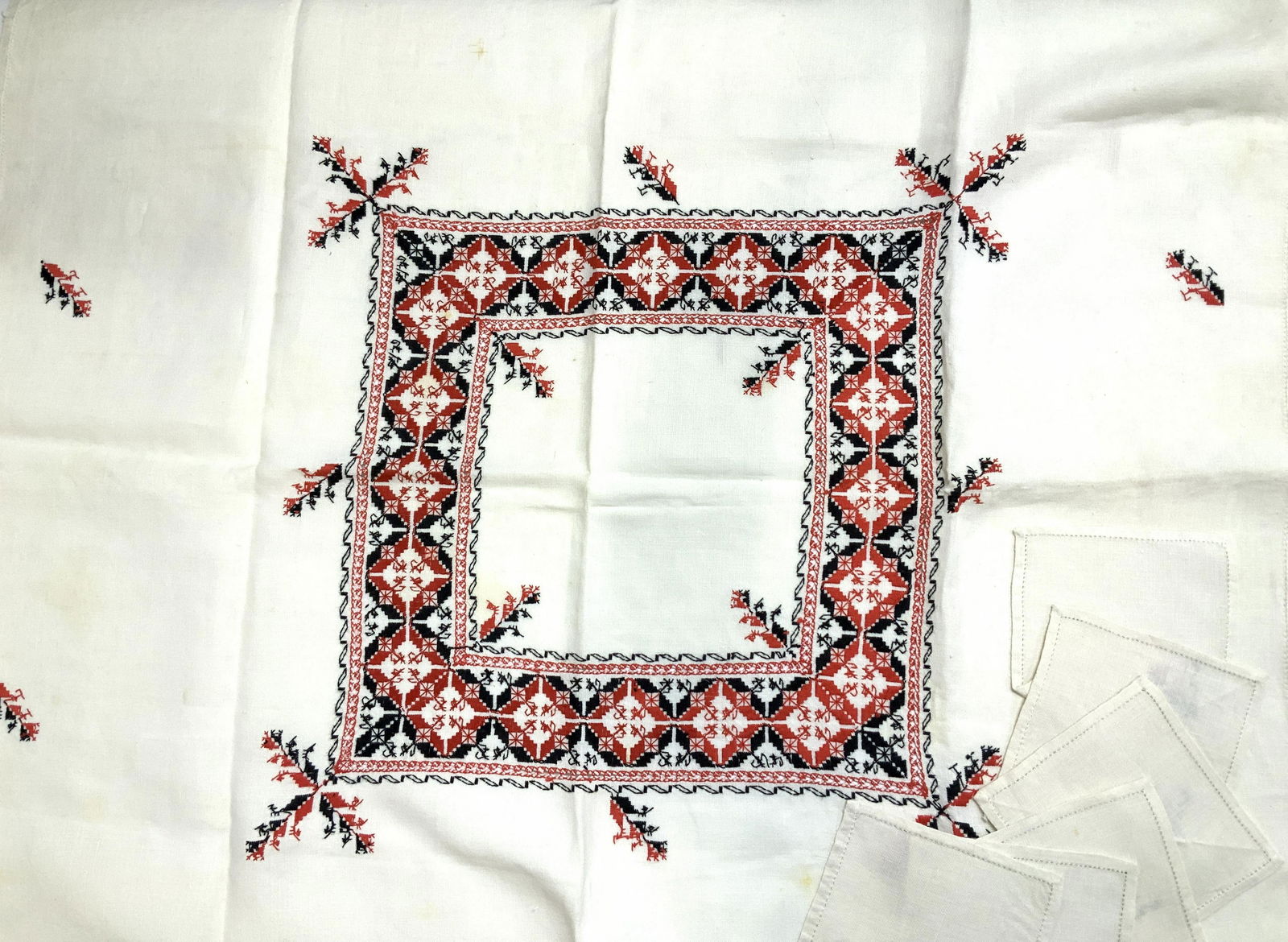 Embroidered Russian Linen Tablecloth & Napkins, 7: Square Kitchen tablecloth, off white thick linen fabric with red and Black Russian folk art embroidery. Tablecloth measures 40 x 40.25 in. Cocktail napkins measure 6 x 6.25 in. Blemishing on tableclot