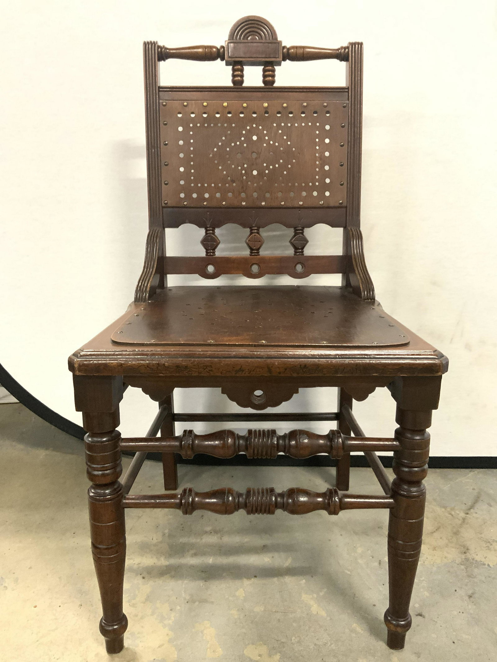 Spanish Colonial Revival Style Wooden Chair: Chair is vintage possibly antique. Piece has Spanish colonial revival style. Chair is brown toned and wooden. Piece measures approx 35 inches tall 20 inches deep 18 inches wide. Chair, wooden chair, v