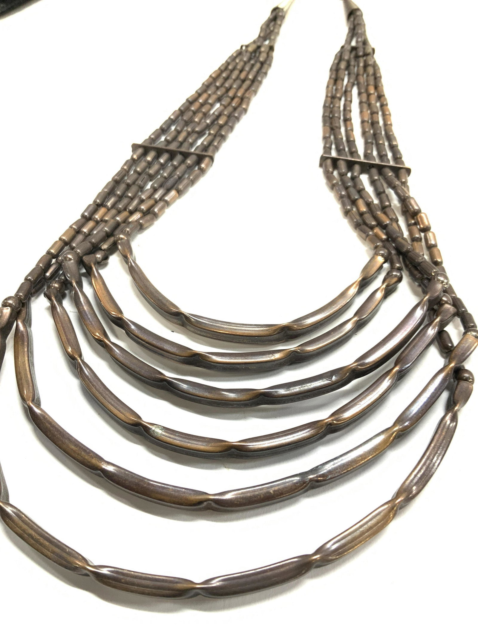Tiered Multi Strand Bronzed Metal Necklace: 6 strand tiered bronze toned metal necklace. Hook and loop clasp, 18 in. With 2.5 in drop. Chunky jewelry, statement Jewelry, vintage jewelry, Estate Jewelry, Costume Jewelry, Ladies Wearable Accessor