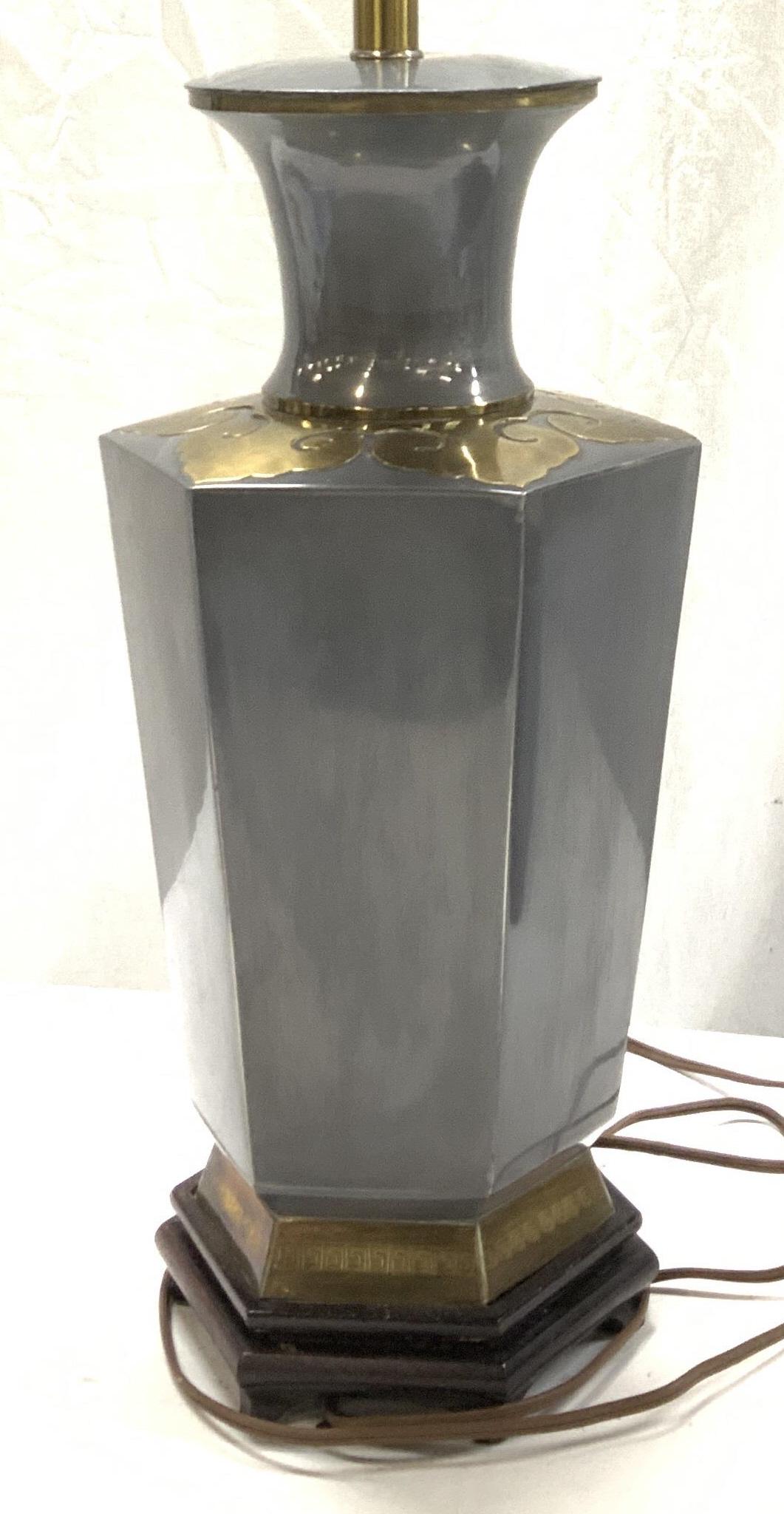 Hexagonal Heavy Metal Asian Lamp w Brass Accents: Accents Hexagonal grey coated metal lamp, wood Asian rosewood base, Greek key brass border and brass Taotie design. Tall lamp harp with brushed nickel finial. Turn switch on socket and switch on cord.