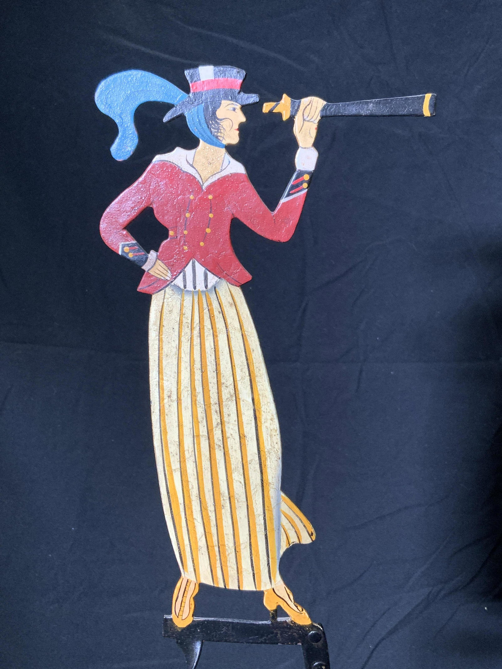 QUAEST Sea Captains Wife Folk Art Balance Toy: QUAEST sea captains wife nautical figural balance toy. Handmade. Trademarked to underside. Constructed of enamel on metal. Toy has weight to underside of figure and rocks back and forth when pushed. T
