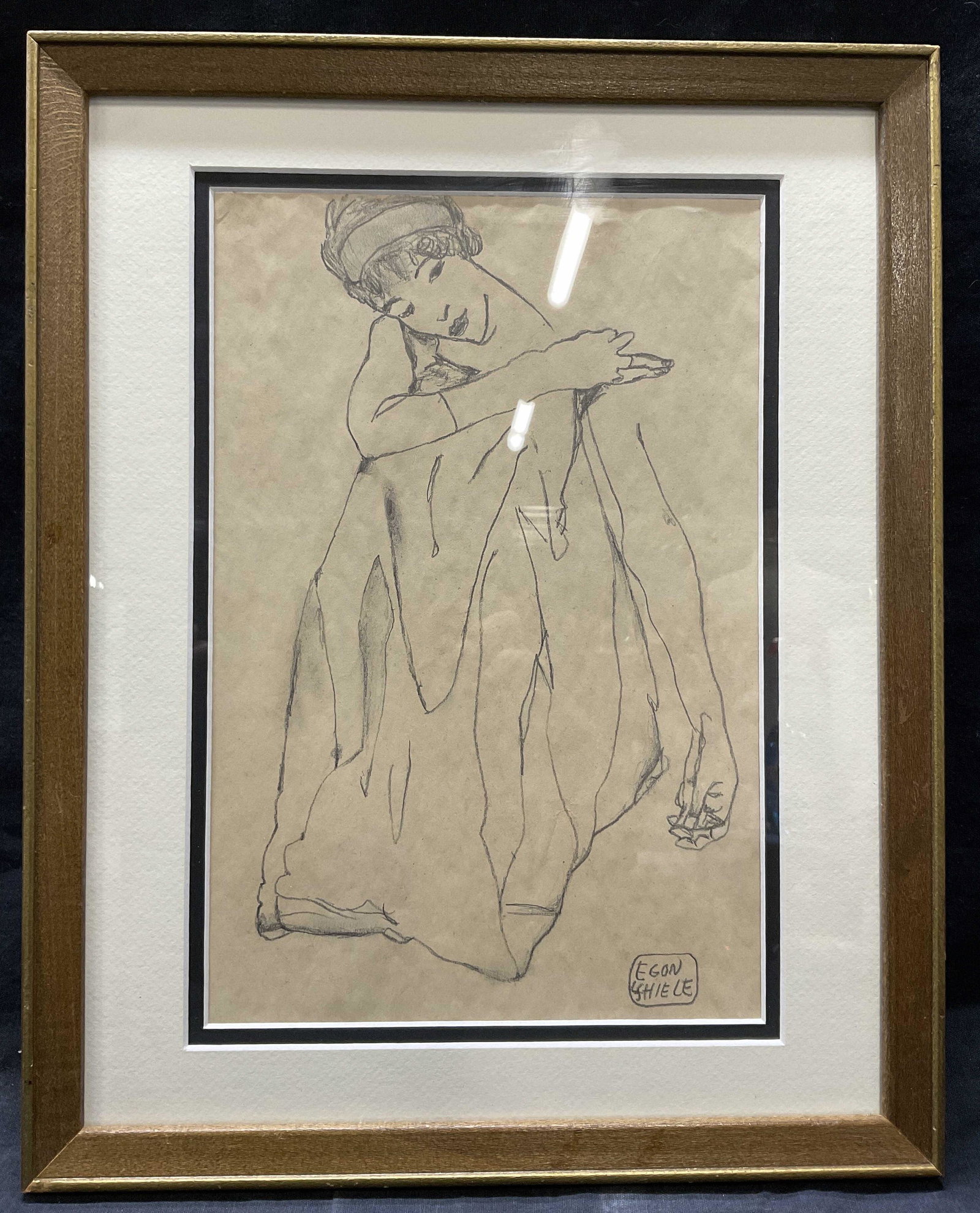 ATTR Egon Scheile Graphite Drawing, Seated Lady: ATTR Framed, Egon Scheile Graphite Darwing of seating woman. Window within matting measures approx 7.5 x 11.25, whole measures approx 12 x 15.25 inches. Behind glass. Double matted in wooden frame. Si