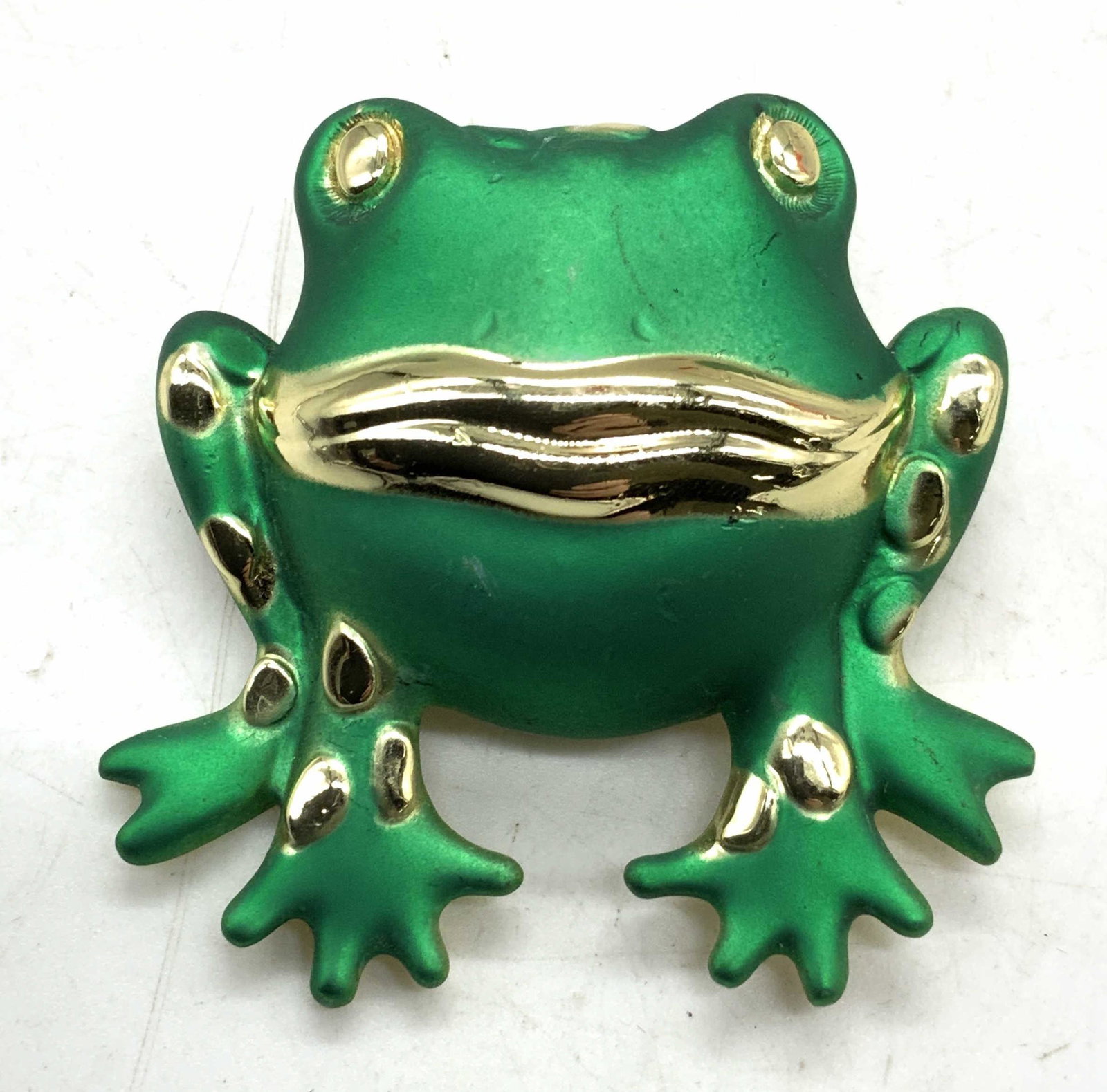 AJC Green Enameled Gold Tone Frog Brooch, Jewelry: AJC Enameled frog brooch with matte green body and gold tone metal. Hinge pin and catch fastener to underside. Some surface wear consistent with exposure. Measures approx. 1.75 x 2 inches. Estate jewe