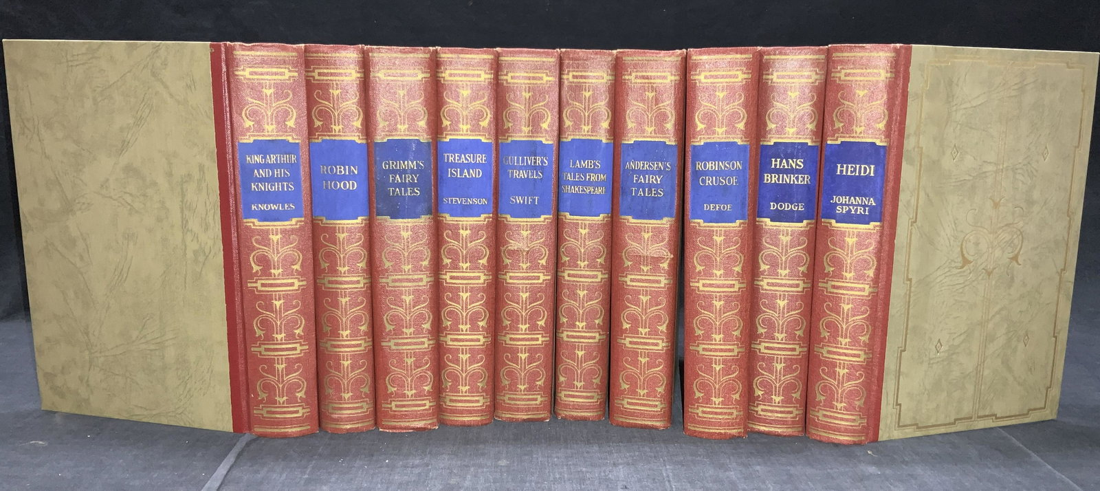 20 Harper & Brothers Hardcover Classics: Set of 10 hardcover books with red spines and green covers with gold designs.Titles include, King Author and His knights, by Knowles, Copyright 1923.Robin Hood, copyright 1940.Grimms Fairy Tales, copy