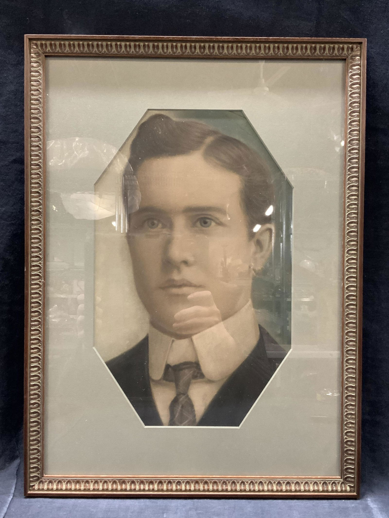 George Burguiere Pastel Portrait: Marked on backside George Burguiere, died about 1907, born 1878. Subject depicts a portrait of a man with brown hair, light eyes and suit with tie. Professionally framed with glass in carved wooden fr