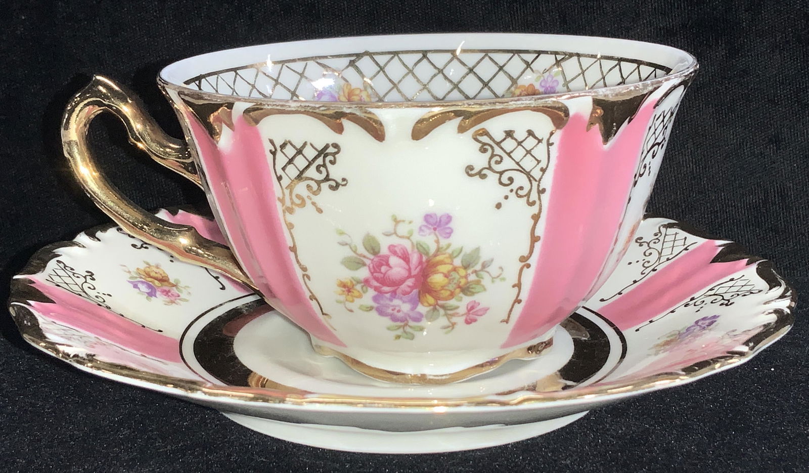 Winterling Pink Gilt Porcelain Cup Saucer GERMANY: vintage porcelain tea cup and saucer, cream toned with 24 K gilt and painted pink with florals. Hallmarked Winterling Bavaria Germany. Saucer measures 5.5 in. Cup measures 2.25 in ht., 4.5 in total wi