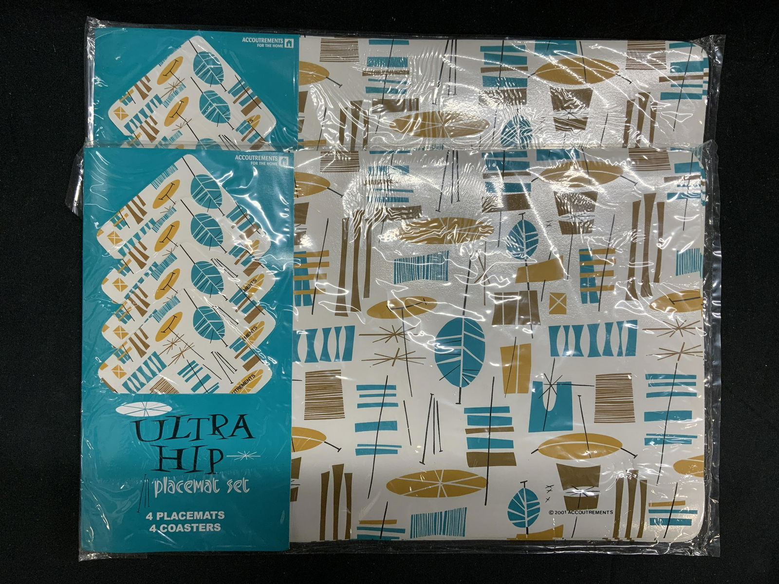 Set 2 Accoutrements Hip Placemats&Coasters NIP: Set of 2 Accoutrements Ultra Hip pattern placemat and coaster sets. Each set contains 4 placemats and 4 coasters. 16 total pieces. New in original packaging. Placemats measure approx. 17.5 x 11 inches