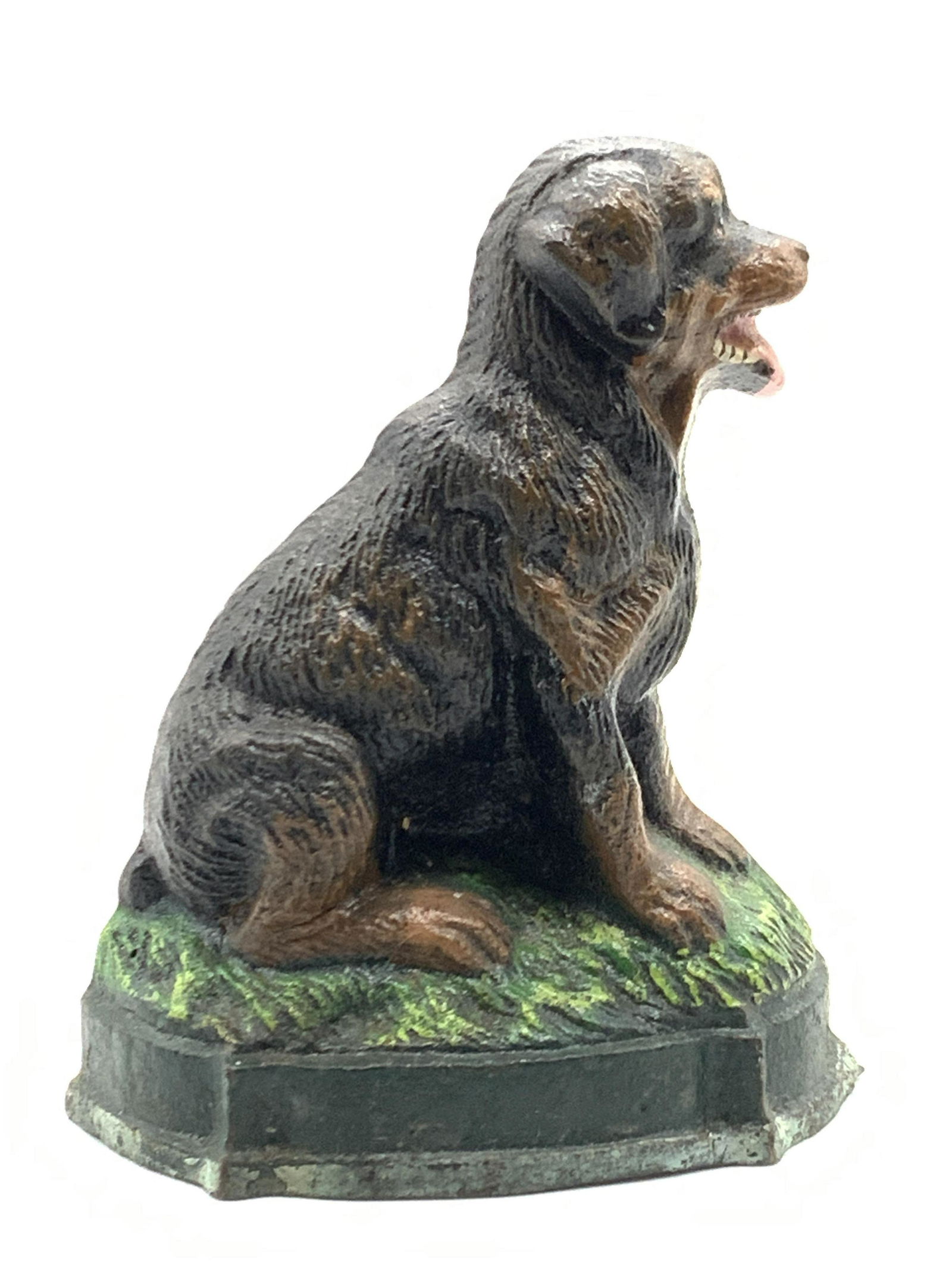 Vintage Painted Cast Iron Rottweiler Dog Door Stop: Vintage iron door stop made to portray a Rottweiler laying on grass. Approximately 4 inches tall. Evident wearing to paint on exterior. Vintage door stop, cast iron door stop, dog decor, dog door stop