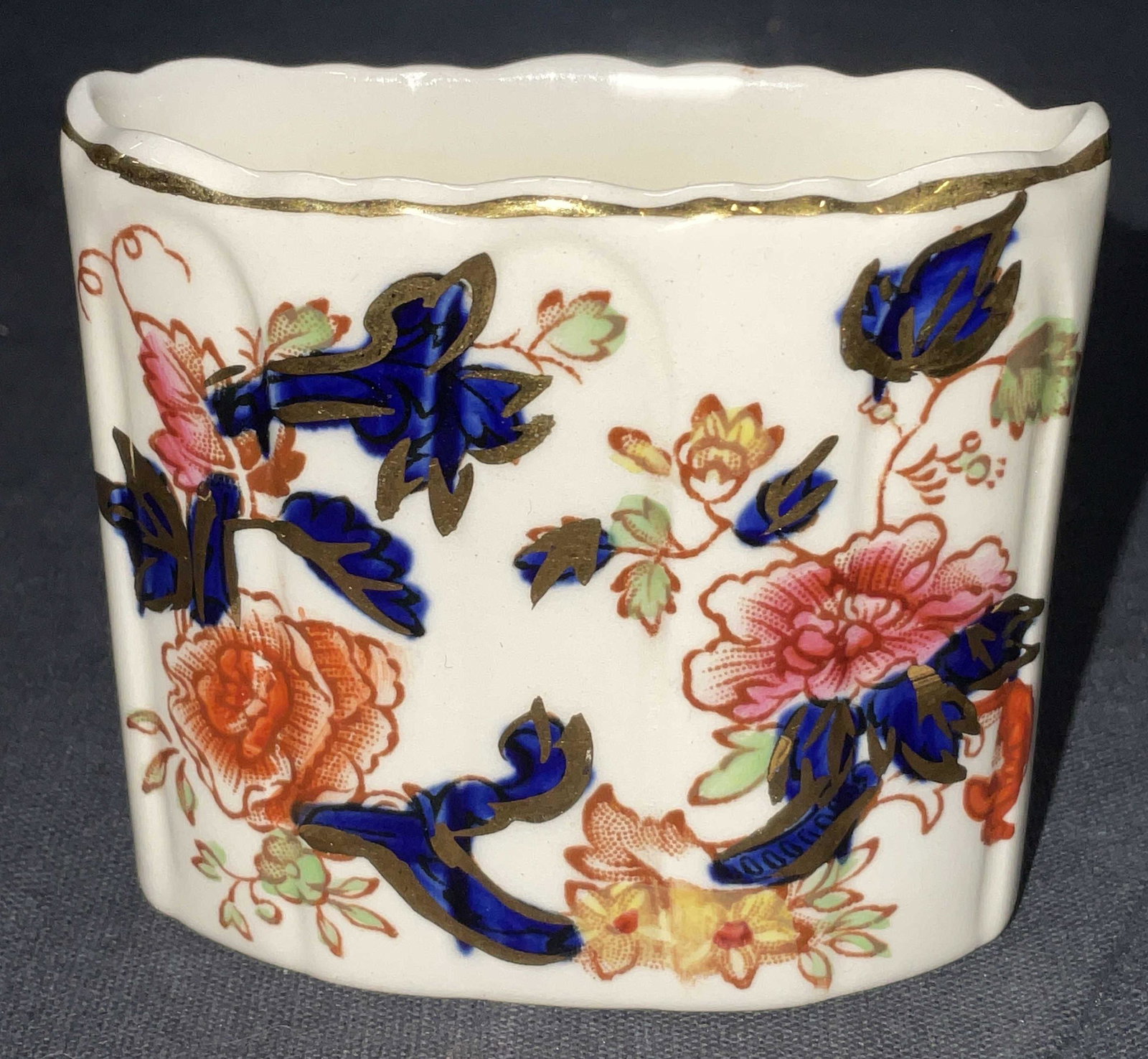 Masons Mandalay Mini Porcelain Vessel ENGLAND: Masons Mandalay Mini Porcelain Vessel. Measures approx 2.5 x 2.25 inches. Floral detail to surface of piece with some gold tone highlights. Obverse reads, Patent Ironstone Mandalay England. Mandalay E
