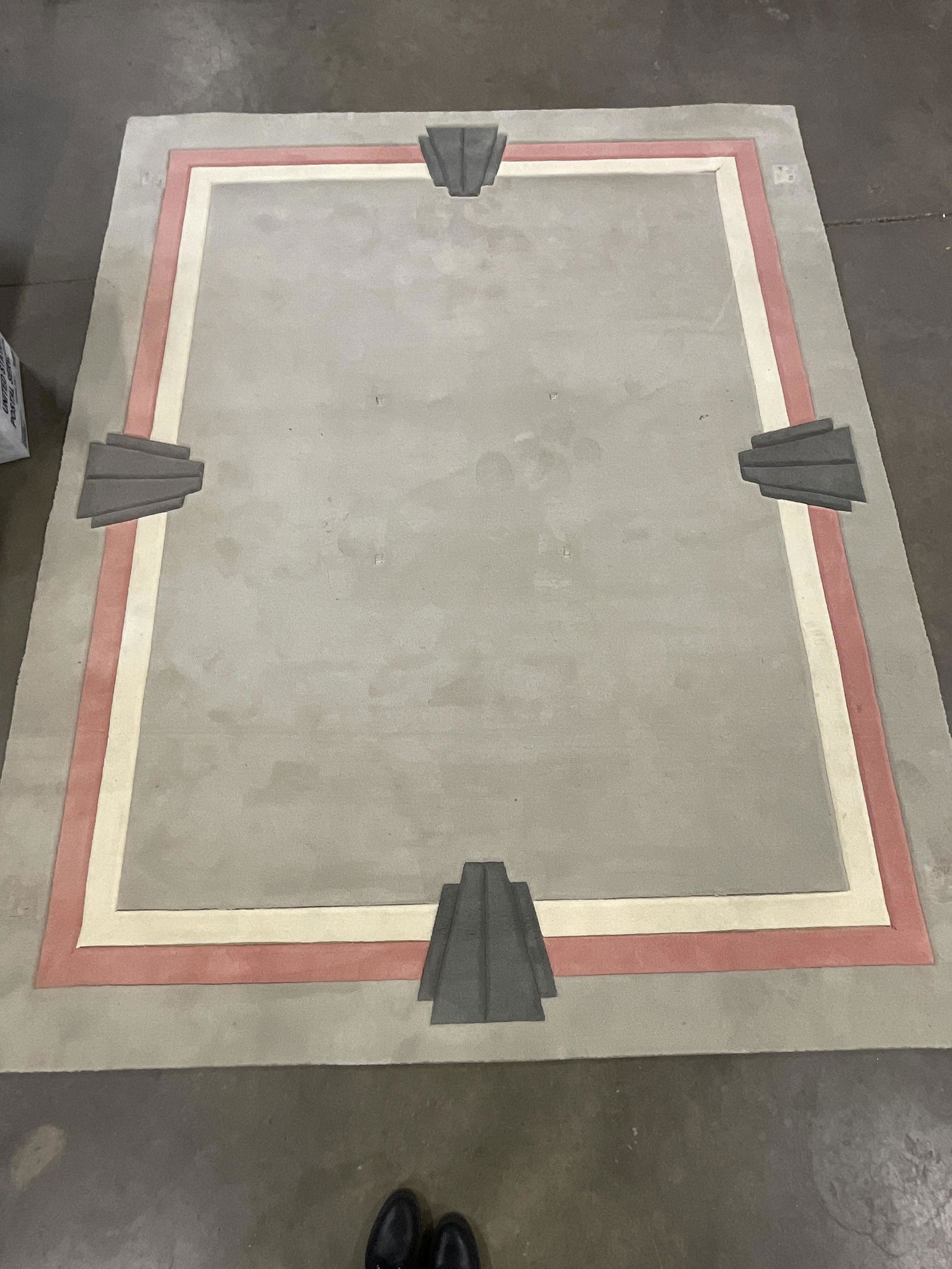 Custom Davis & Davis Art Deco Area Rug: Custom Davis & Davis Art Deco Area Rug. Label to back side. Measure approx 8 FT x 10FT. Significant surface wear to piece, some stains to rug & minor up lifting of color panels, (see photos). Coral, t