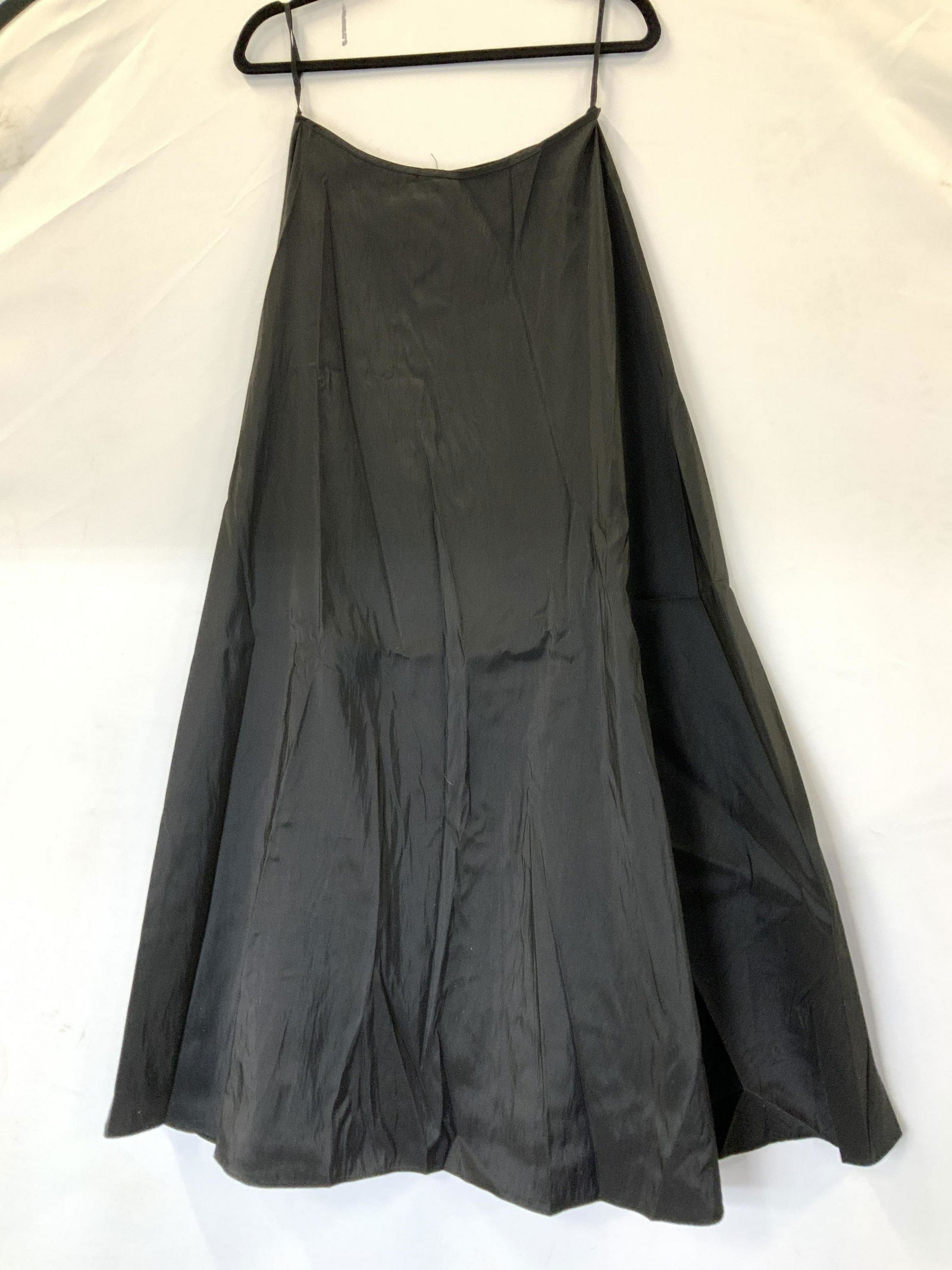 Ariella A Line Ankle Length Evening Wear Skirt: Flowy long Length skirt with an A Line Shape, size Medium. Gradually Flares outward, waist, Ladies size M. 27 in waist, hips 30 in. across, lower hem 60 + in. 100% polyester with sheen. Backside zippe