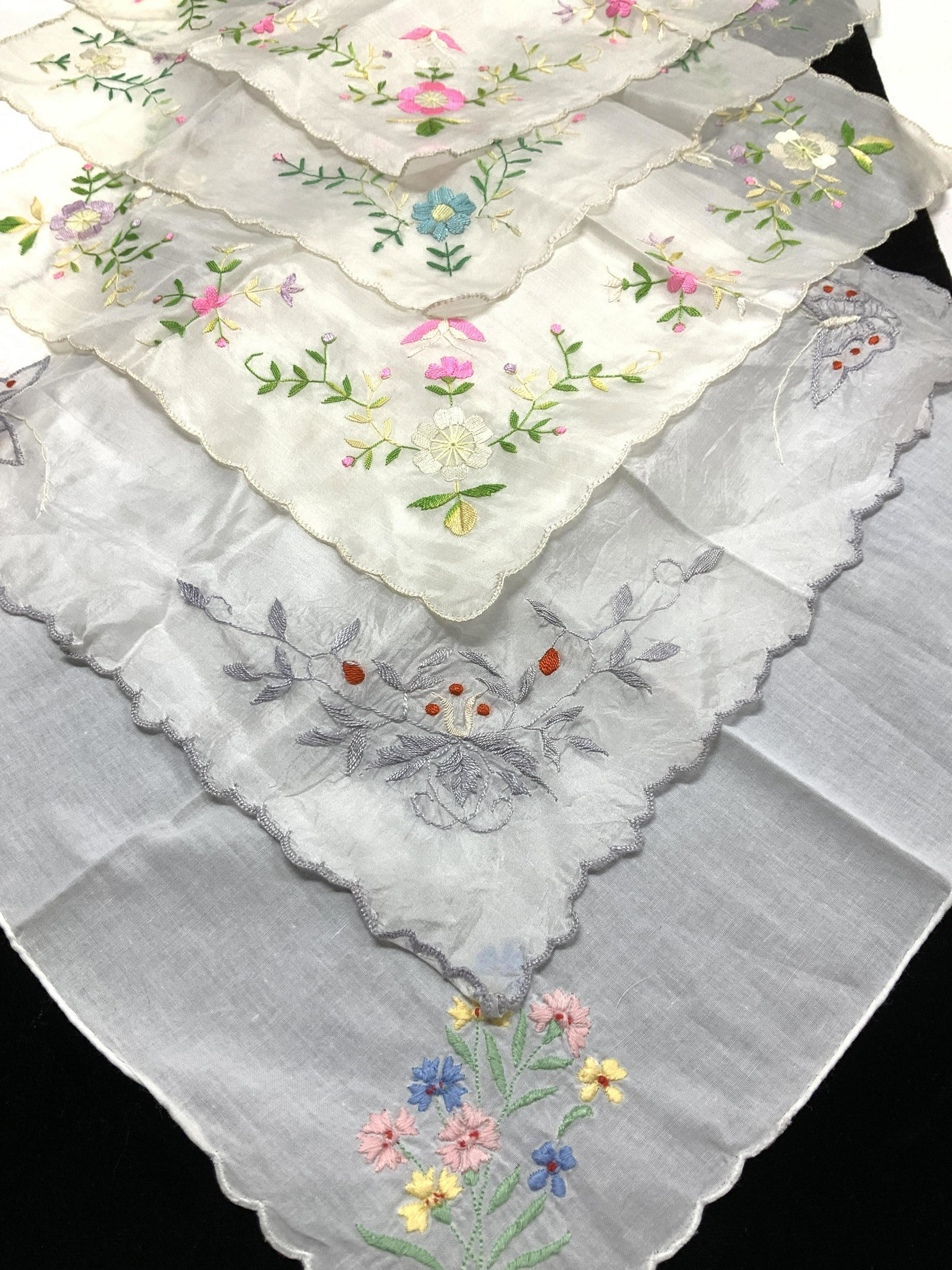 Vtg Embroidered Hankies, 11: Set of 5 embroidered flower hankies, all similar with scallop edges, bright pink, lavender and green colors. Avg size 12.75 x 12.75 in. On a silky fabric with sheen. Same fabric Hankie but with embroi