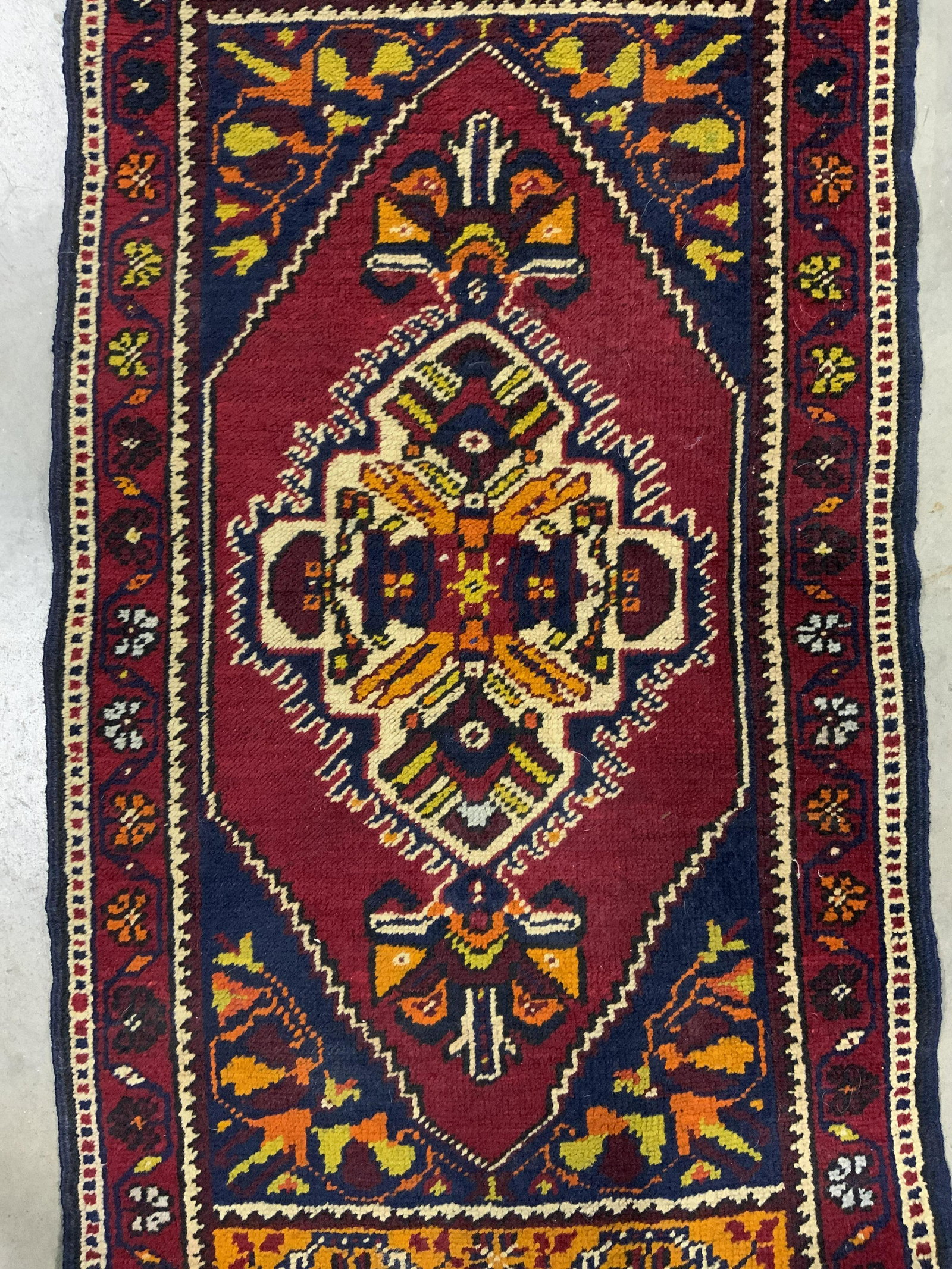 Vintage Handmade Wool Turkish Rug: Rug is handmade and wool. Piece is vintage possibly antique. Rug has intricate multi toned floral & geometric detail. Piece measures approx 42 inches long 22 inches wide. Rug, carpet, handmade rug, Tu