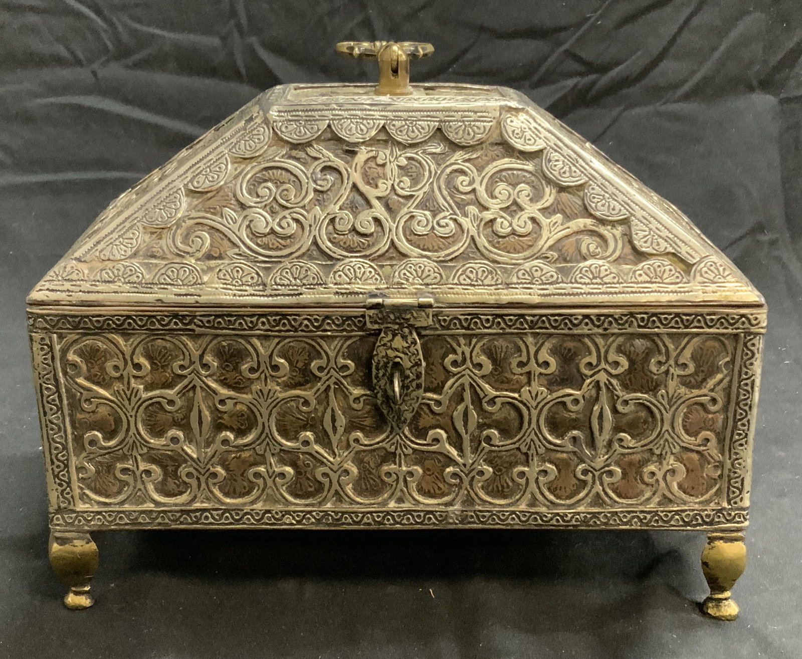 Vintage Embossed Metal Jewelry Box: Vintage embossed metal jewelry box with green velvet lined interior. Measures approx. 8 x 5 x 6 inches. Surface wear consistent with exposure. Hallmarked to underside. Jewelry box, vintage jewelry box