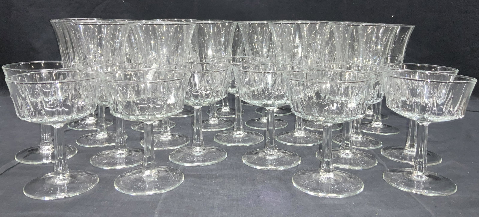 35 Ice Cream & Sorbet Stemware Glasses, France: Set of 35 stemware glasses. 11 glasses at, 4.5 inch tall with shallow wide cups 24 glasses at 6.25 inches tall with long cups. All marked France on undersides and with faceted stems. Glass stemware, s