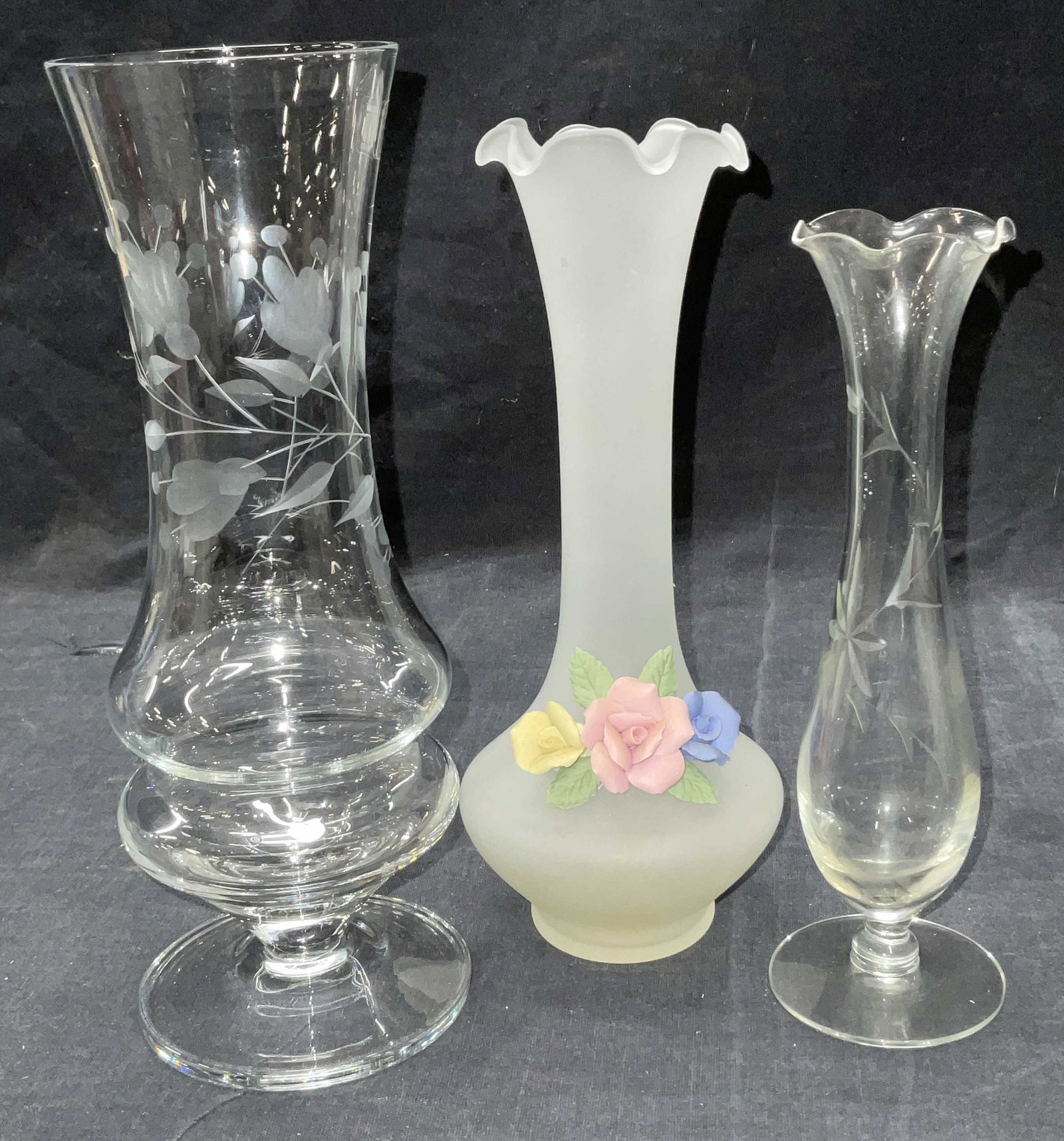 Lot 3 Cut Glass Vases, Poland: Lot 3 Cut Glass Vases. 2 Glass vases with cut detail to surface , 1 labeled Krosno,made in poland. 1 vessel is frosted with Rose relief detail & handkerchief edge to top. Largest measures approx 8.75 