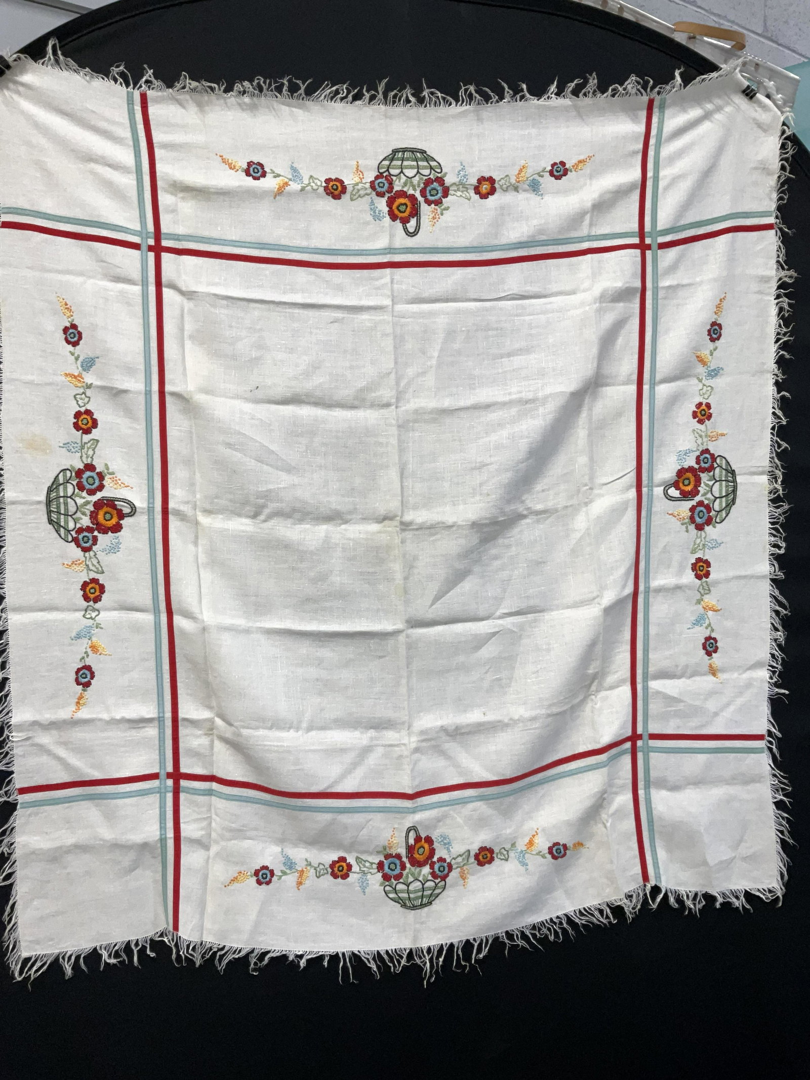 Floral Embroidered / Fringed Table Cloth: Floral Embroidered / Fringed Table Cloth. Possibly vintage. Some staining to surface (see photos). Measures approx 43.5 x 47 inches. No material tag or name label. Possibly linen. Cottage core, up cyc