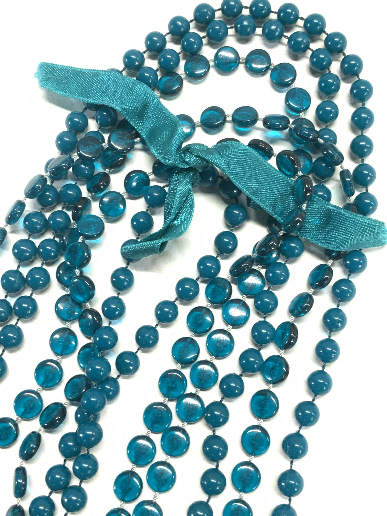 Rope Length Teal Bead Necklace: Dual strand necklace, one strand has round teal beads, the other strand has semi translucent disc beads. 60 in long with teal ribbon . Lightweight . vintage jewelry, Estate Jewelry, Costume Jewelry, L