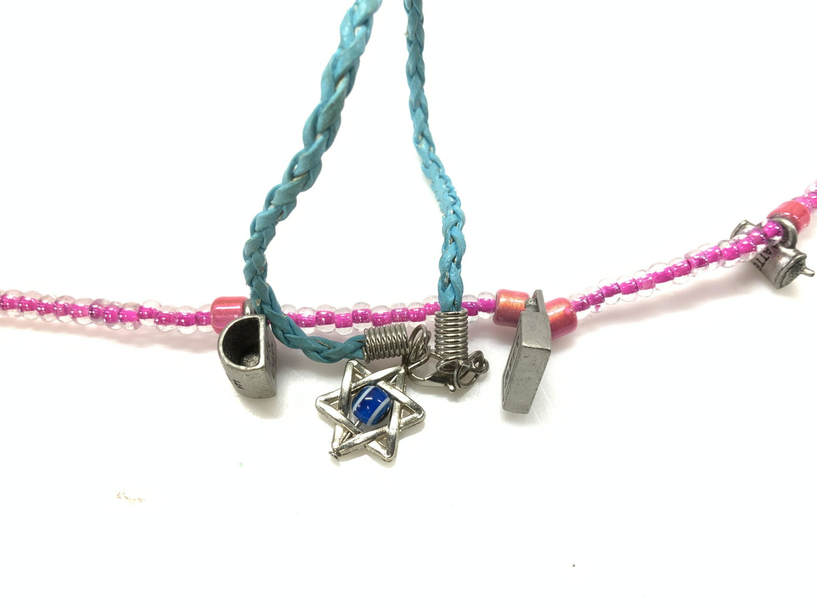 Pair Charm Bracelets, Star of David Charm: Braided Blue cord bracelet with Star of David charm and center blue glass bead. needs new clasp, or slip over wrist, 7 in long. Pink beaded bracelet with coffee cup charm, latte charm and beer charm. 