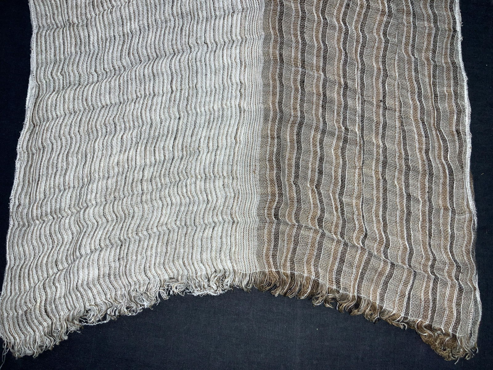 Vintage Double Toned Scarf: Vintage scarf, two sided with vertical patterns in tones of orange, ,reds and greens. Possibly made of silk, soft hand. Approximately 66 inches long and 14 inches wide. Minor wearing to scarf, evident