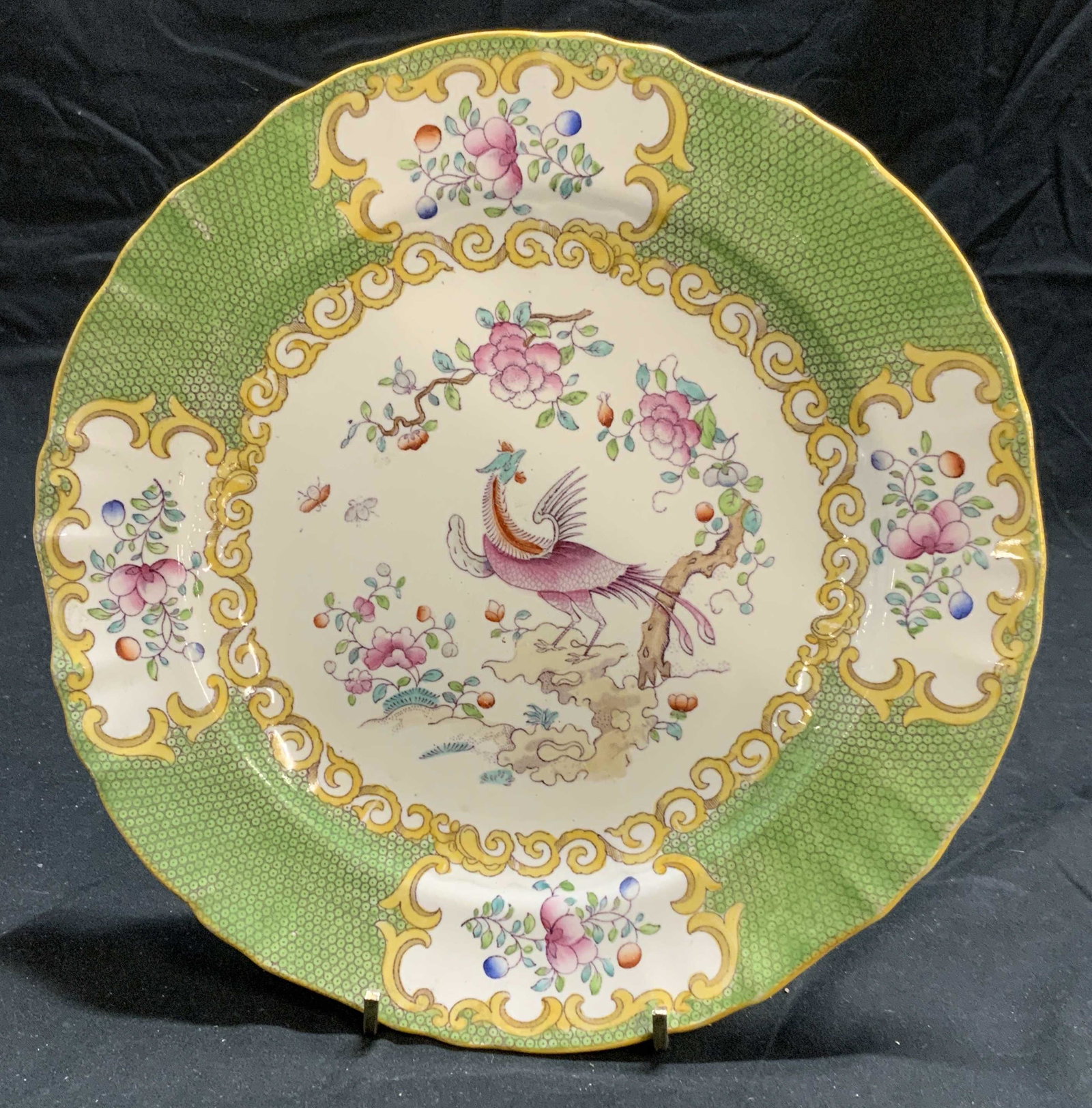 Antique MINTONS T GOODE Porcelain Plate: Antique MINTONS T Goode and Co porcelain plate with Asian peacock motif and green border. Trademarked to underside. Measures approx. 9 inches diameter. Some surface wear consistent with exposure. MINT