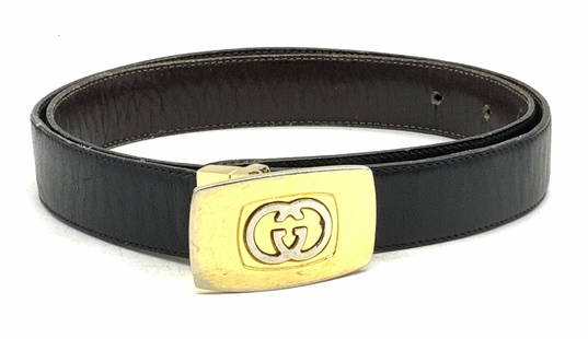 GUCCI Black Leather G Buckle Belt, Luxury Menswear: Gucci black leather belt with possibly gold plated G buckle. Designer label stamped to metal. Measures approx. 36.5 inches long. Some wear to metal and leather consistent with exposure. Gucci, Gucci b