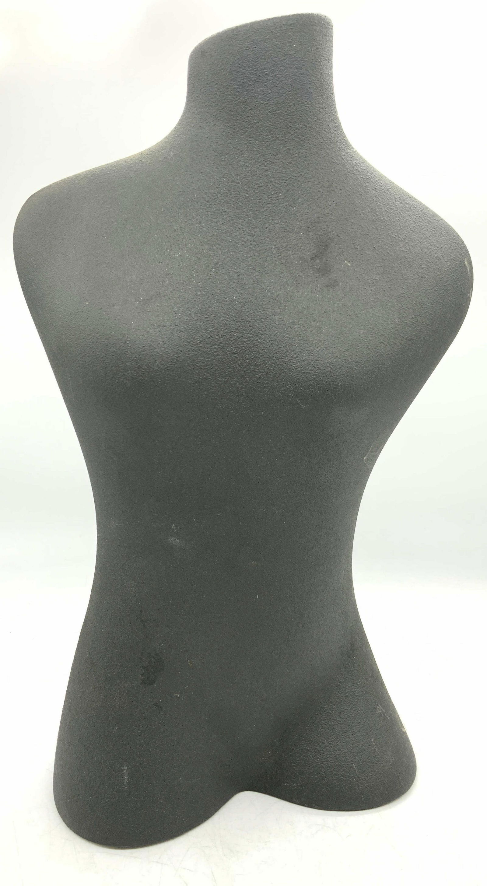 Female Figural Earthenware Vessel: Earthenware vessel, vase made of coarse clay. Gray in tone in the shape of a nude female figure. Approximately 13.25 inches tall and 7 inch long base. Evident wearing to undersides. Female Figural. Ea