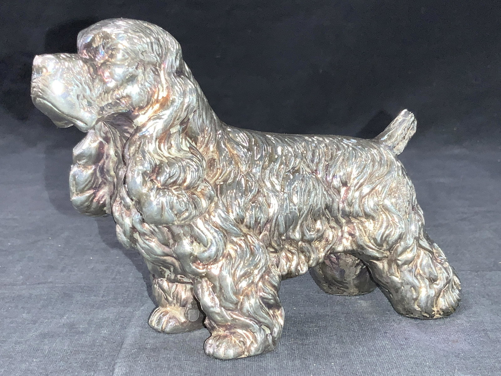 Sterling King Charles Spaniel Dog Sculpture: Sterling silver sculpture depicting a King Charles Spaniel. Approximately 4.25 inches tall and 6 inches long. Total weight 8.68 ozt. Marked 925 on underside. Sterling silver sculpture, sterling silver