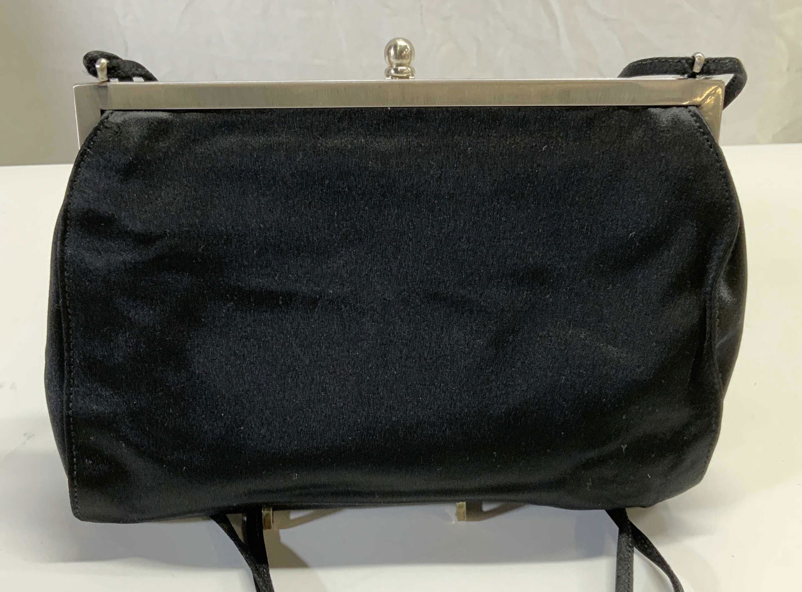 PRADA Raso Marchio Black Satin Handbag: Vintage Prada Raso Marchio black toned satin evening bag. Includes certificate of authenticity. Authenticity has not been verified. Evening bag measures approx. 8.25 x 3.25 x 5 inches. Strap drop appr