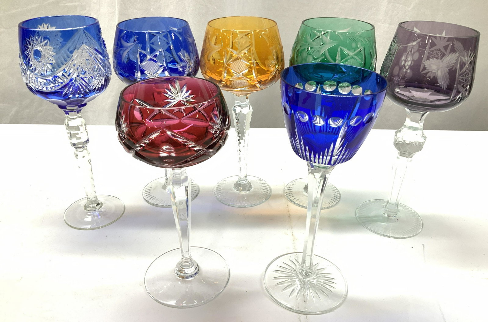 Grp 7 Cut Crystal Bohemian Stemware: Luxury vintage cut crystal boehm wine glasses, different cut patterns, shapes and heights. Many grape motifs and Art Deco. Set of 3 with matching patterns, 1 cobalt blue, 1 saffron, 1 emerald. 8 x 3.5