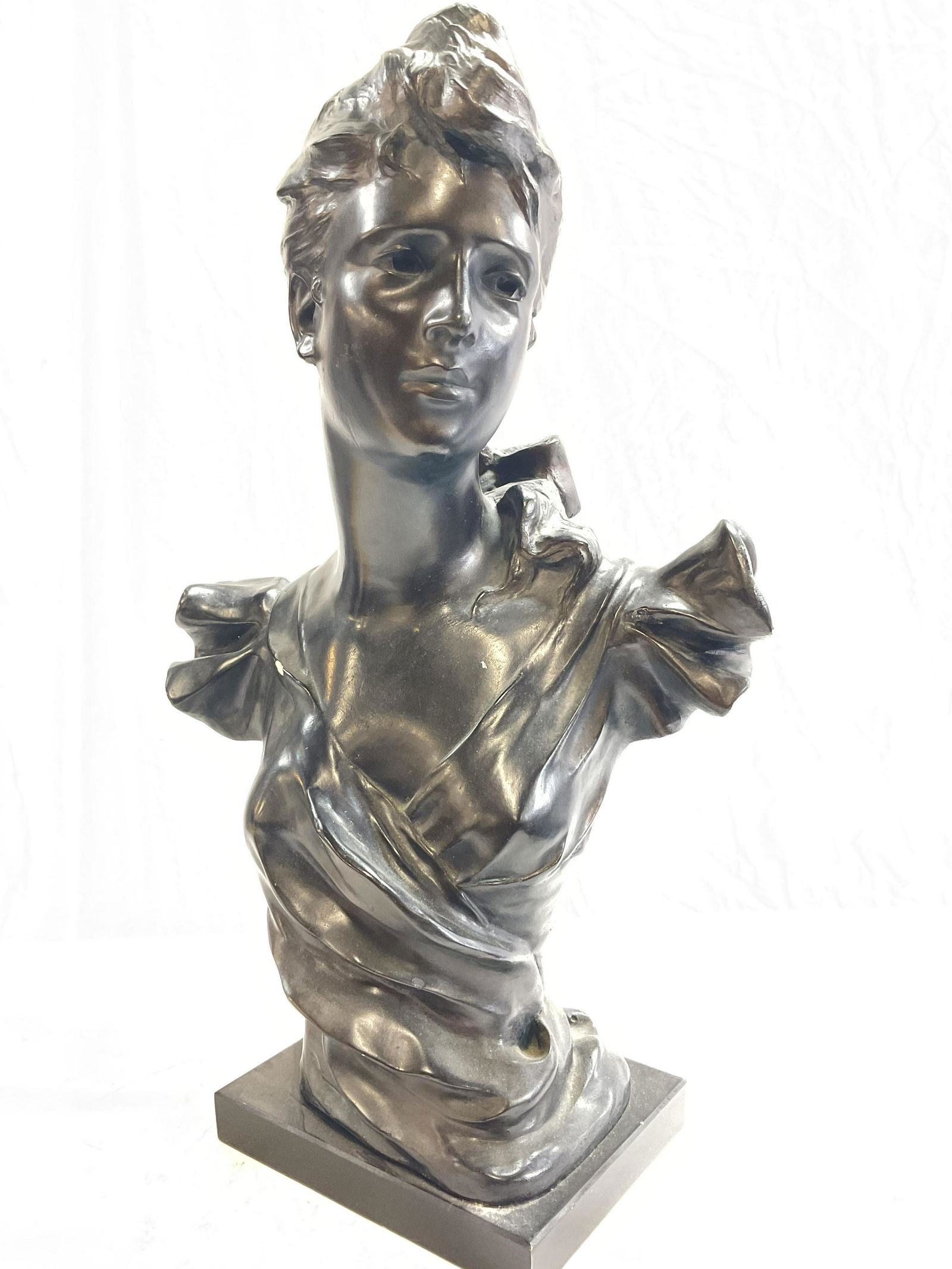SGN Austin Prod Inc. Art Deco Woman Bust: Signed Austin Productions Sculpture of art deco woman bust. Embossed to back Austin Prod Inc 1983, illegible number mark to piece. Measures approx 22 x 14 x 8 inches, some chipping to bust (see photos