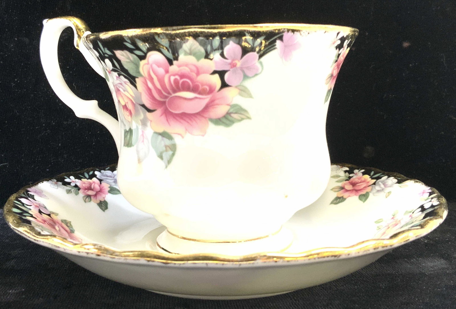 ROYAL ALBERT CONCERTO Porcelain Teacup & Saucer: Underside of each piece reads ROYAL ALBERT BONE CHINA ENGLAND CONCERTO. Lot includes 1 teacup & 1 saucer. Each piece has multi toned floral and leaf detail in addition to gold gilt rims. Saucer measur