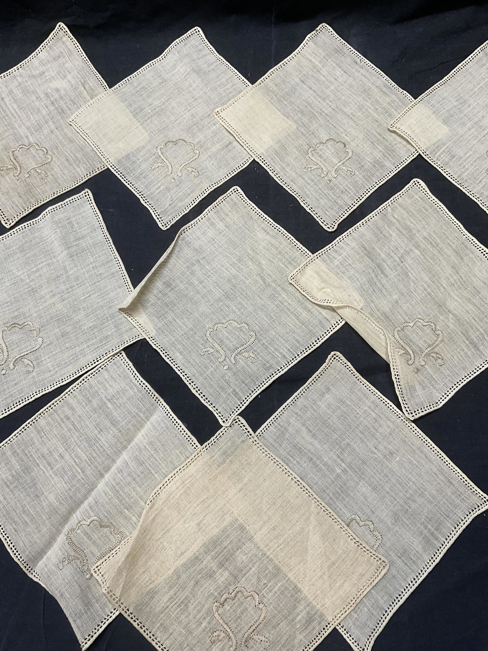 Lot 10 Vintage Embroidered Doilies: Lot 10 Vintage Embroidered Doilies. Significant wear to pieces, discoloration and minor stain to some. Measures approx 7 x 7.25 inches. No name or material label to piece. all cleaned starched pressed