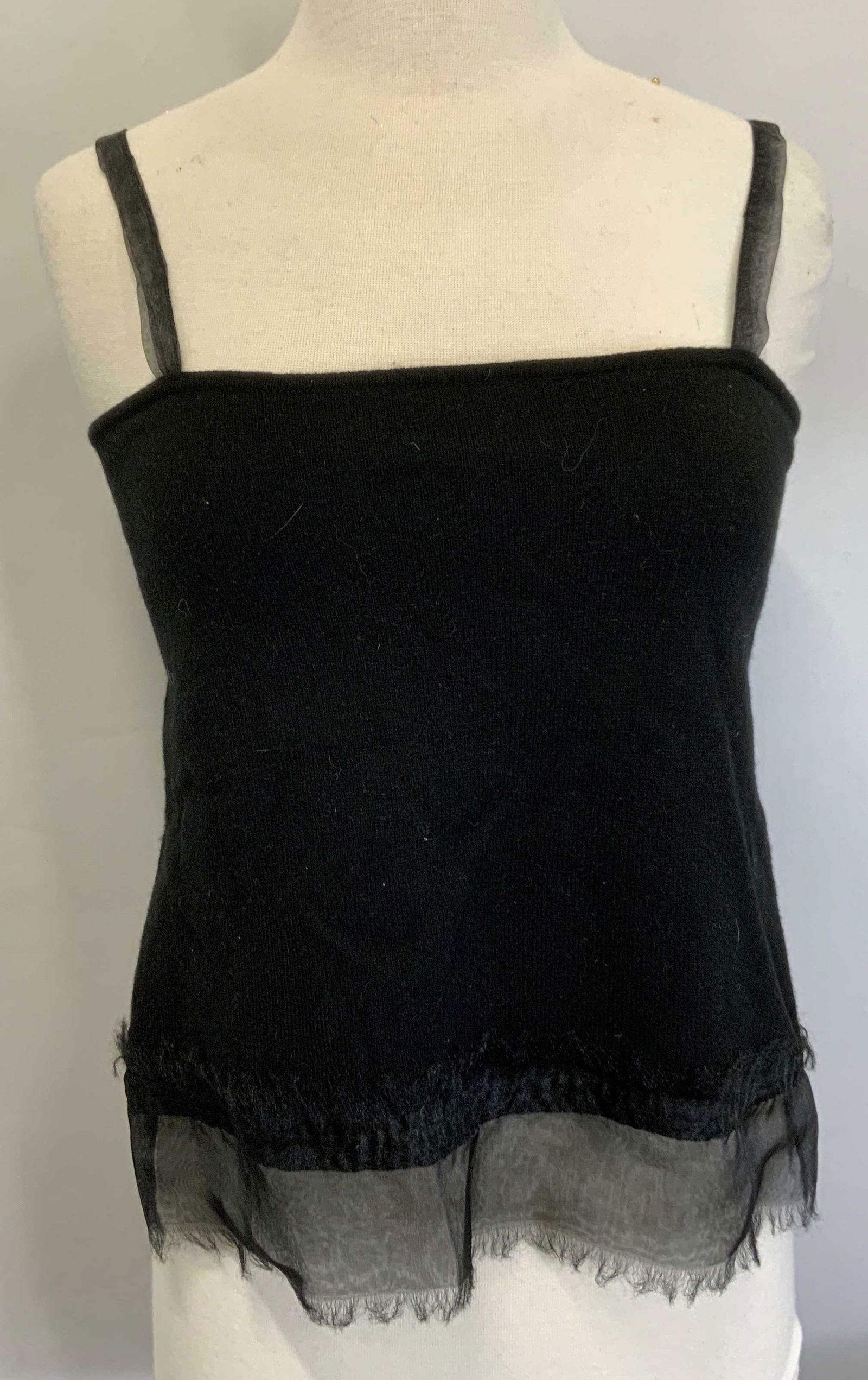 DKNY Black Sleeveless Cashmere Top: DKNY black sleeveless cashmere top with open back and button detail. Size M. Gently worn. Property of Manhattan, New York Estate of D. Winston, matchmaker to the stars, NYC Socialite and philanthropis