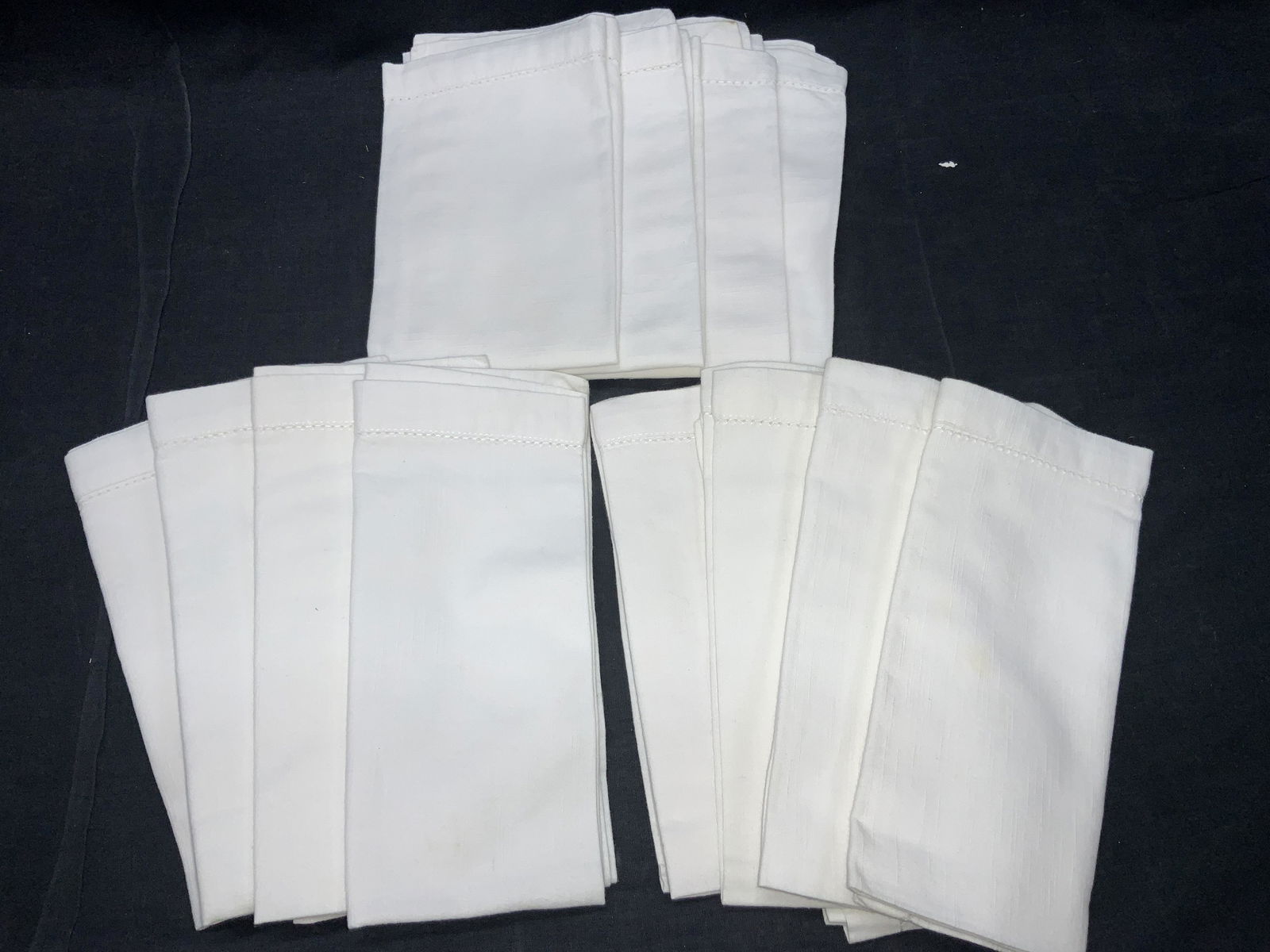 Set 12 Starch White Hand Towels: 12 white hand towels with strewn edges. Ranging in sizes between 17 x 18 inches, 19.5 x 18 inches. 8 towels at 17 x 18 inches and 4 at 19.5 x 18 inches. Evident blemishes due to use.White vintage line