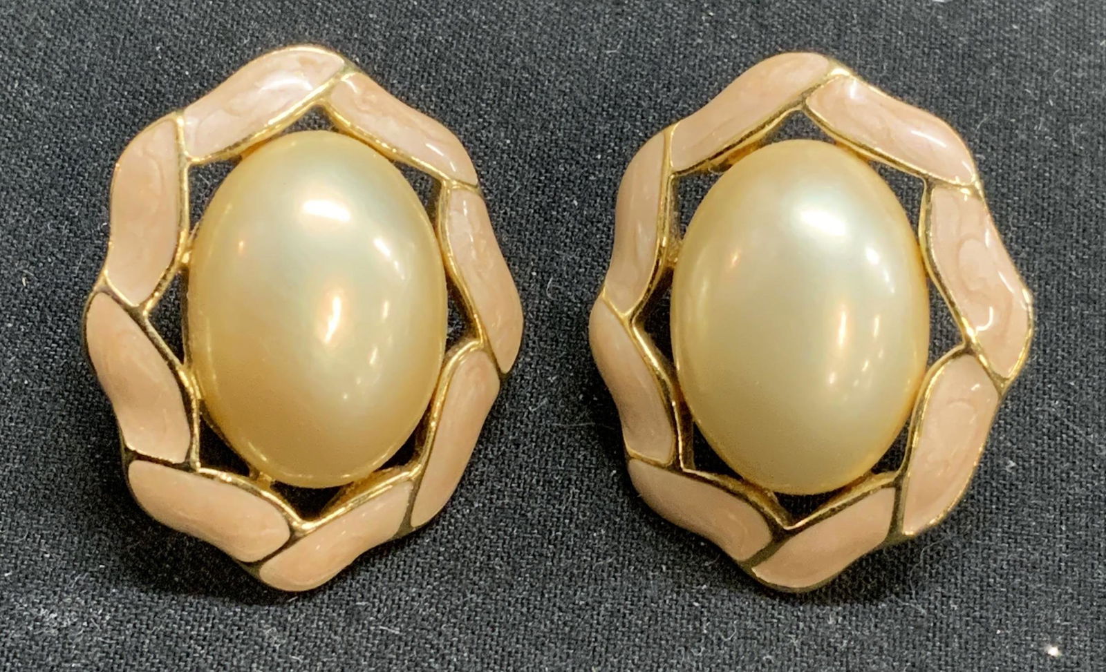 Vintage TRIFARI Faux Pearl Enamel Earrings: Vintage Trifari gold tone earrings with faux pearl Cabochon and pink enamel. Post backing, needs replacement. Designer label to underside. Measures approx. 1 x 7/8 inches. Property of Palm Beach, Flor