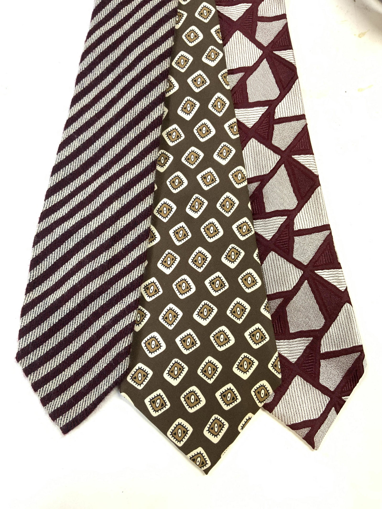 Lot 3 RALPH LAUREN Purple Label Necktie & More: Lot includes 1 necktie with purple label which reads RALPH LAUREN MADE IN ITALY MADE BY HAND, 1 Necktie which reads N PEAL BURLINGTON ARCADE LONDON MADE IN GREAT BRITAIN 100% CASHMERE, & 1 Necktie whi