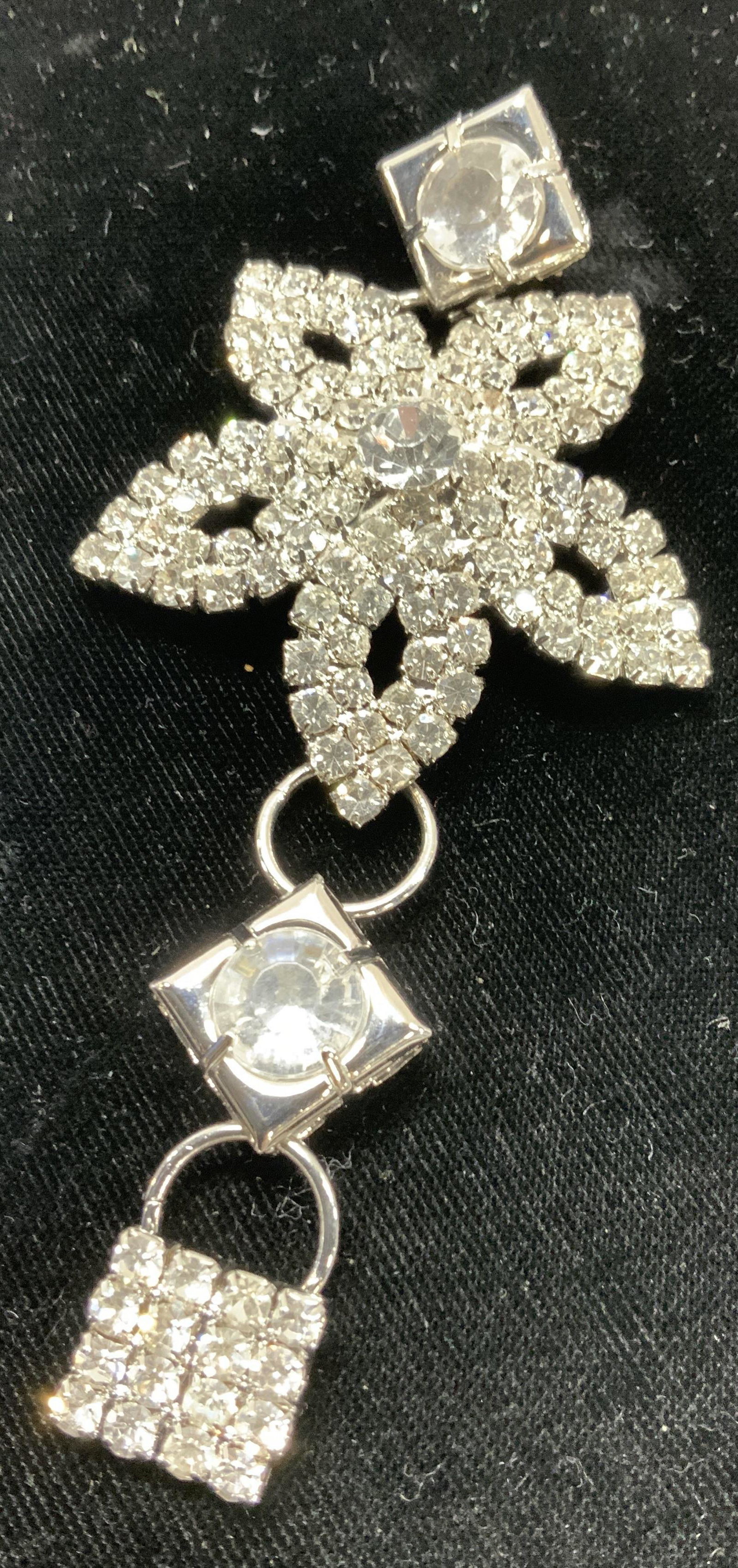 XL Clear Crystal Flower Accessory, 4in Jewelry: 2 in. crystal flower accessory attached to other crystal and rhinestone charms. Up cycle into new jewelry, add a back pin for a brooch, make into a bracelet or pendant, use for fashion. Total length o