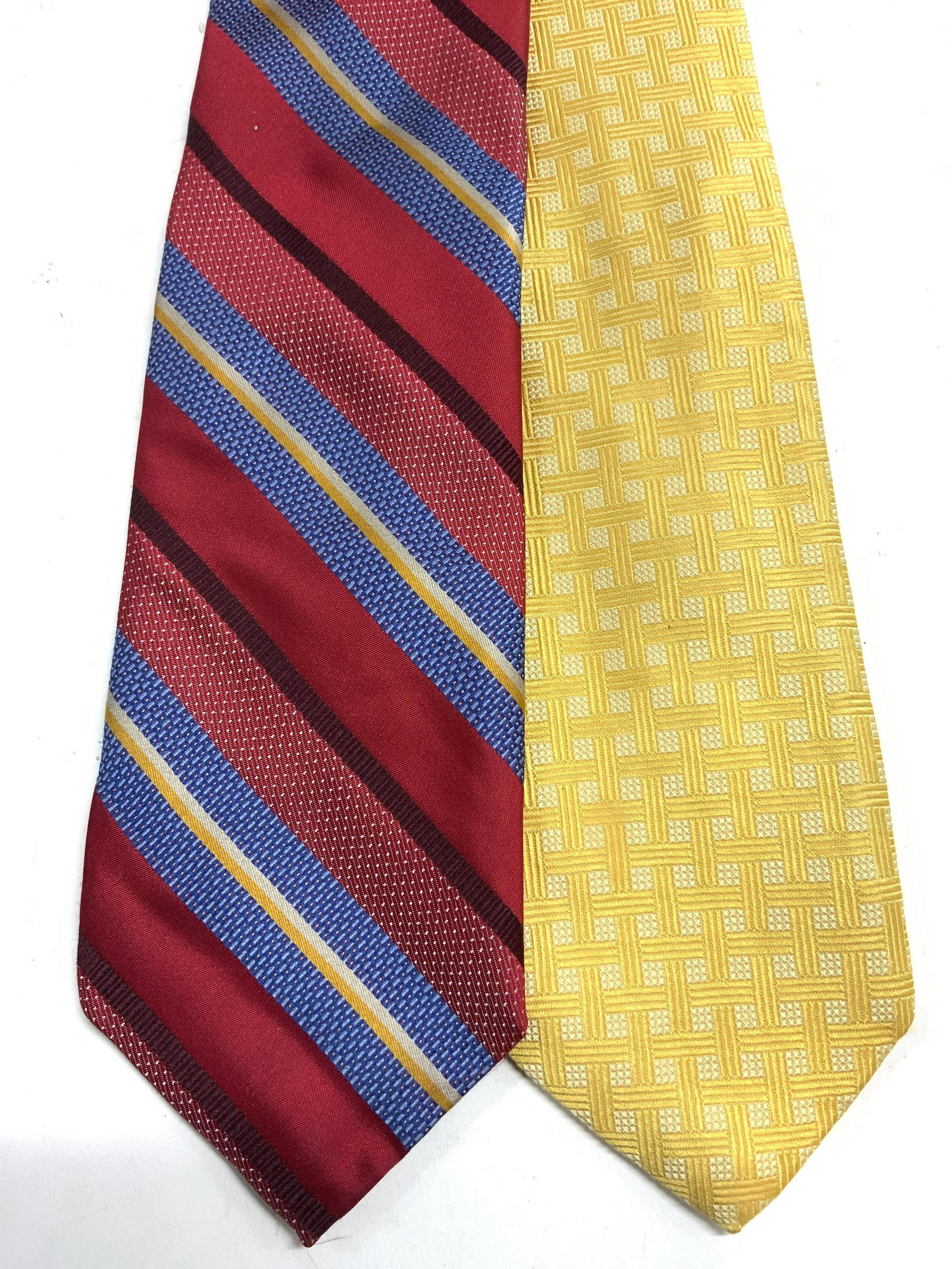 Lot 2 ROBERT TALBOT NORDSTROM Hand Sewn Silk Ties: Tags each read ROBERT TALBOT BEST OF CLASS NORDSTROM. Ties each read HAND SEWN. Lot includes 1 gold toned tie & 1 red, maroon, blue & gold diagonal striped tie. Largest tie measures approx 55 inches l