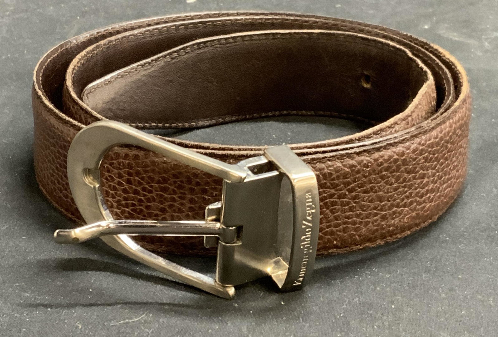ERMENEGILDO ZEGNA Brown Leather Belt: Ermenegildo Zegna brown leather belt. Size 38. Designer label to leather and metal. Made in Italy. Some wear to leather consistent with exposure. Ermenegildo zegna, Ermenegildo zegna belt, designer me