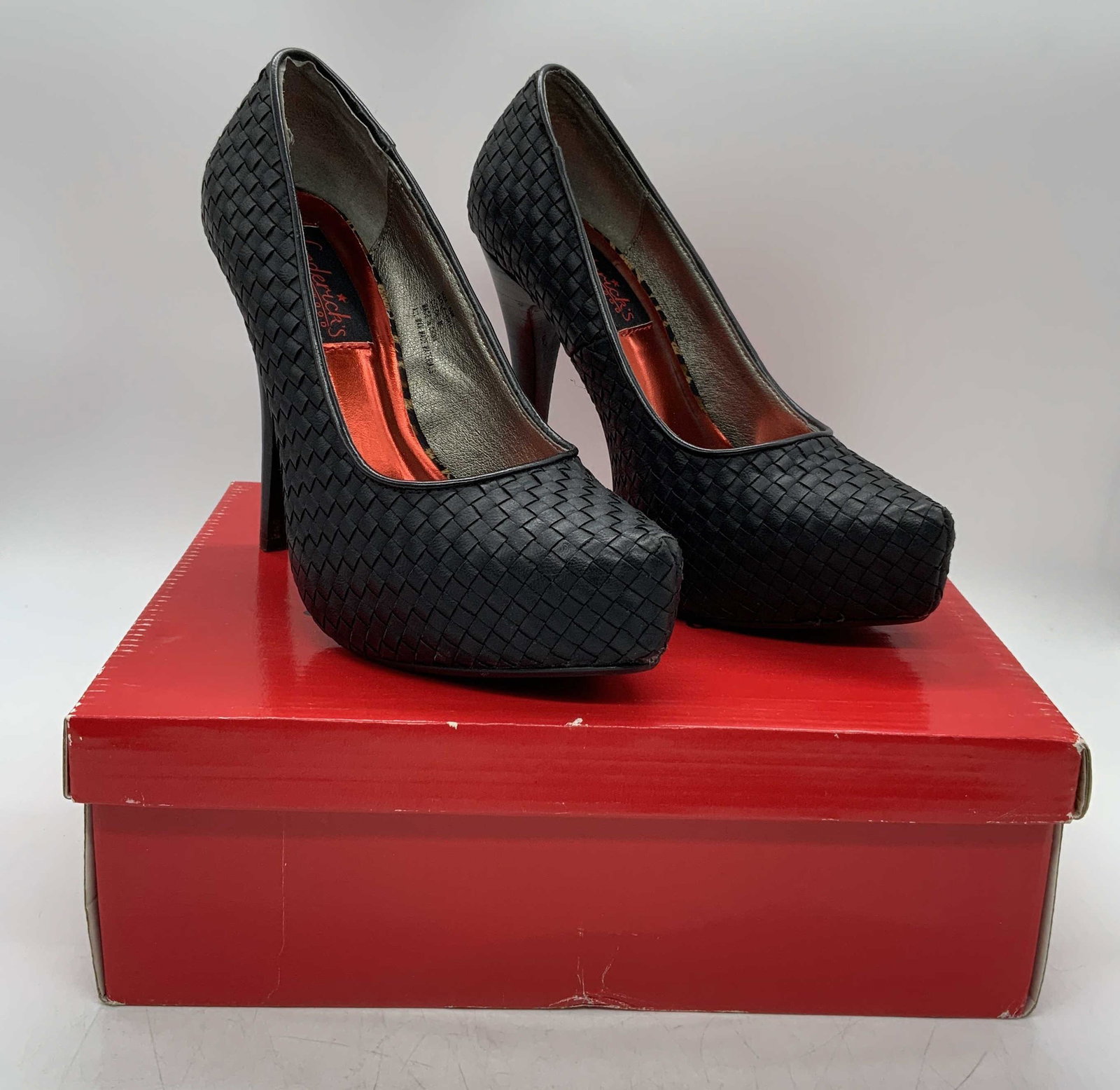 FRDERICKS HOLLYWOOD Black Platform Heels: Fredericks of Hollywood black woven platform heels. Size 5.5. Heel height approx. 5 inches. Some wear to soles consistent with use. Synthetic materials. Fredericks of Hollywood, ladies designer heels,
