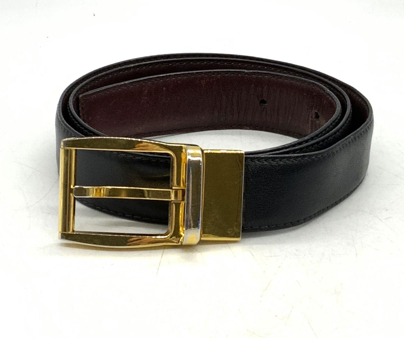 MARK CROSS Black Leather Belt: Mark Cross black leather belt. Measures approx. 38 inches long. Designer label to buckle. Some wear to leather consistent with exposure. Mark cross, mark cross belt, designer menswear, mens designer b