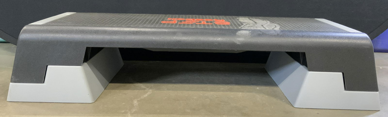 REEBOK STEP Stepper Gym Stepper: Top of piece reads REEBOK STEP. Stepper has tones of black red & grey. Piece measures approx 39 inches long15 inches deep 8 inches tall. Stepper, Reebok stepper, gym stepper, Reebok step, gym equipmen