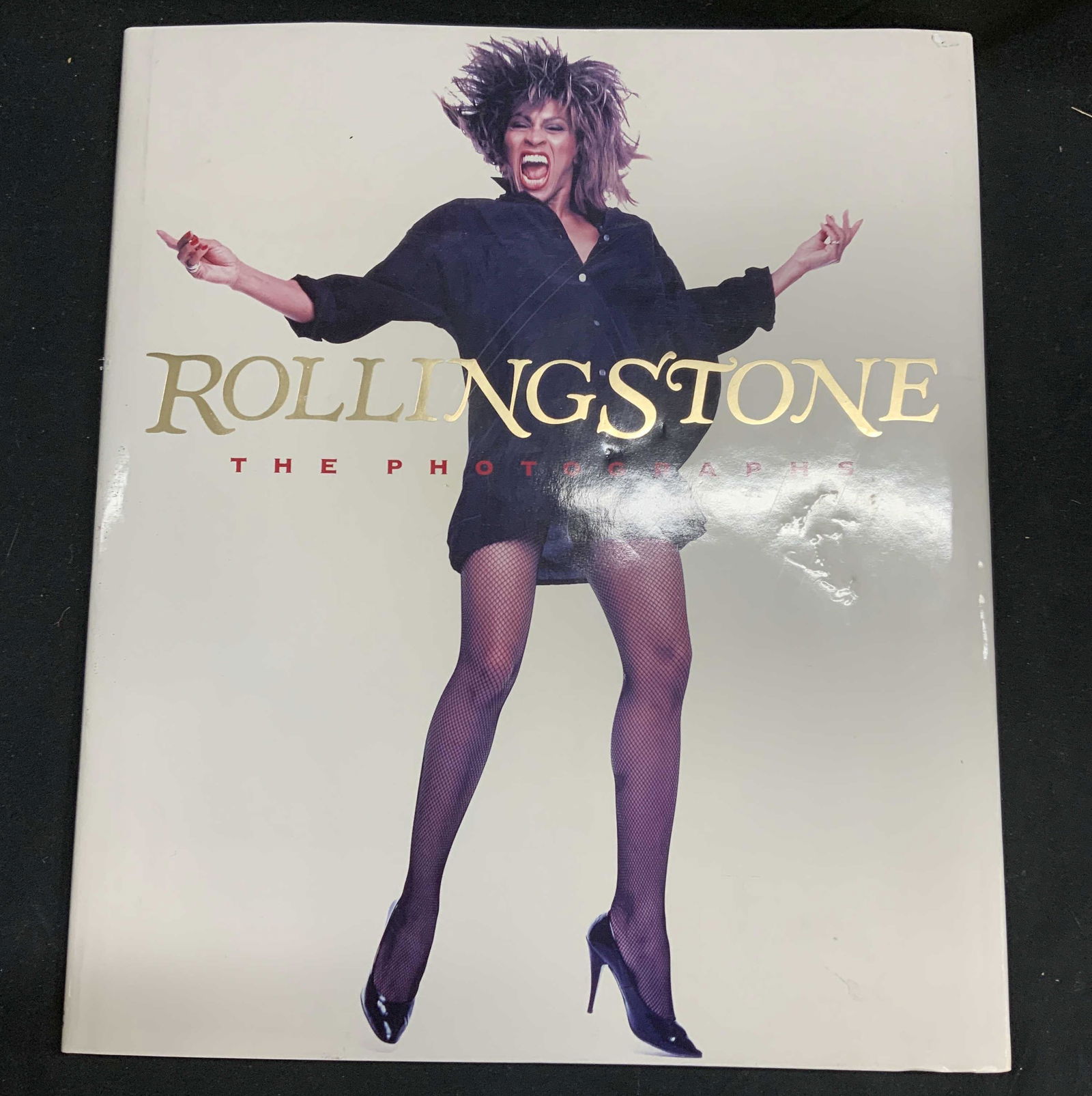 Rolling Stone The Photographs Coffee Table Book: Hardcover copy of Rolling Stone: The Photographs with preface by Tome Wolfe and introduction by Jann S. Wenner. Published by Simon and Schuster, 1989. Measures approx. 12.25 x 14.25 inches. Some wear